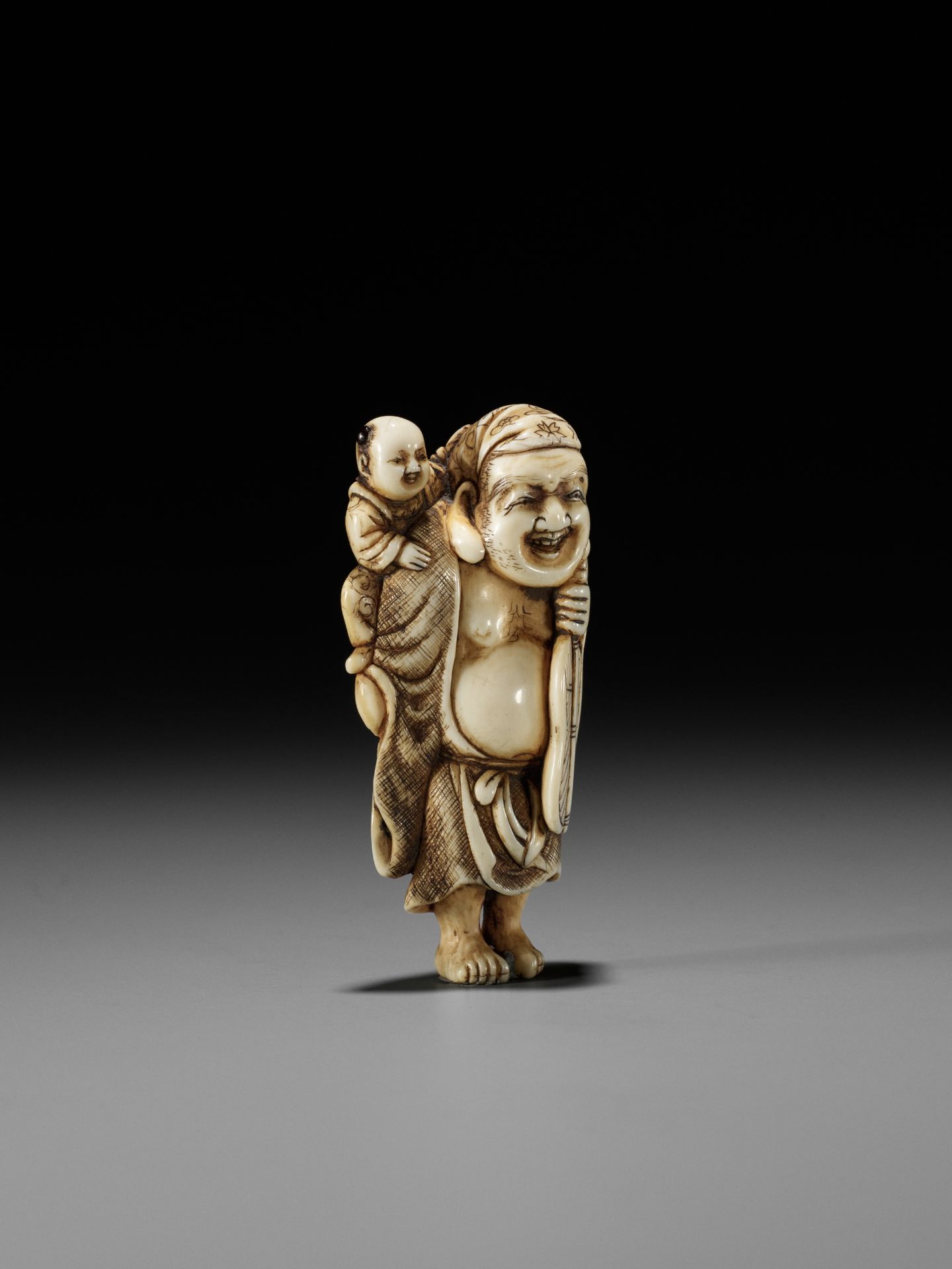 OKAKOTO: AN IVORY NETSUKE OF HOTEI WITH KARAKO - Image 8 of 12