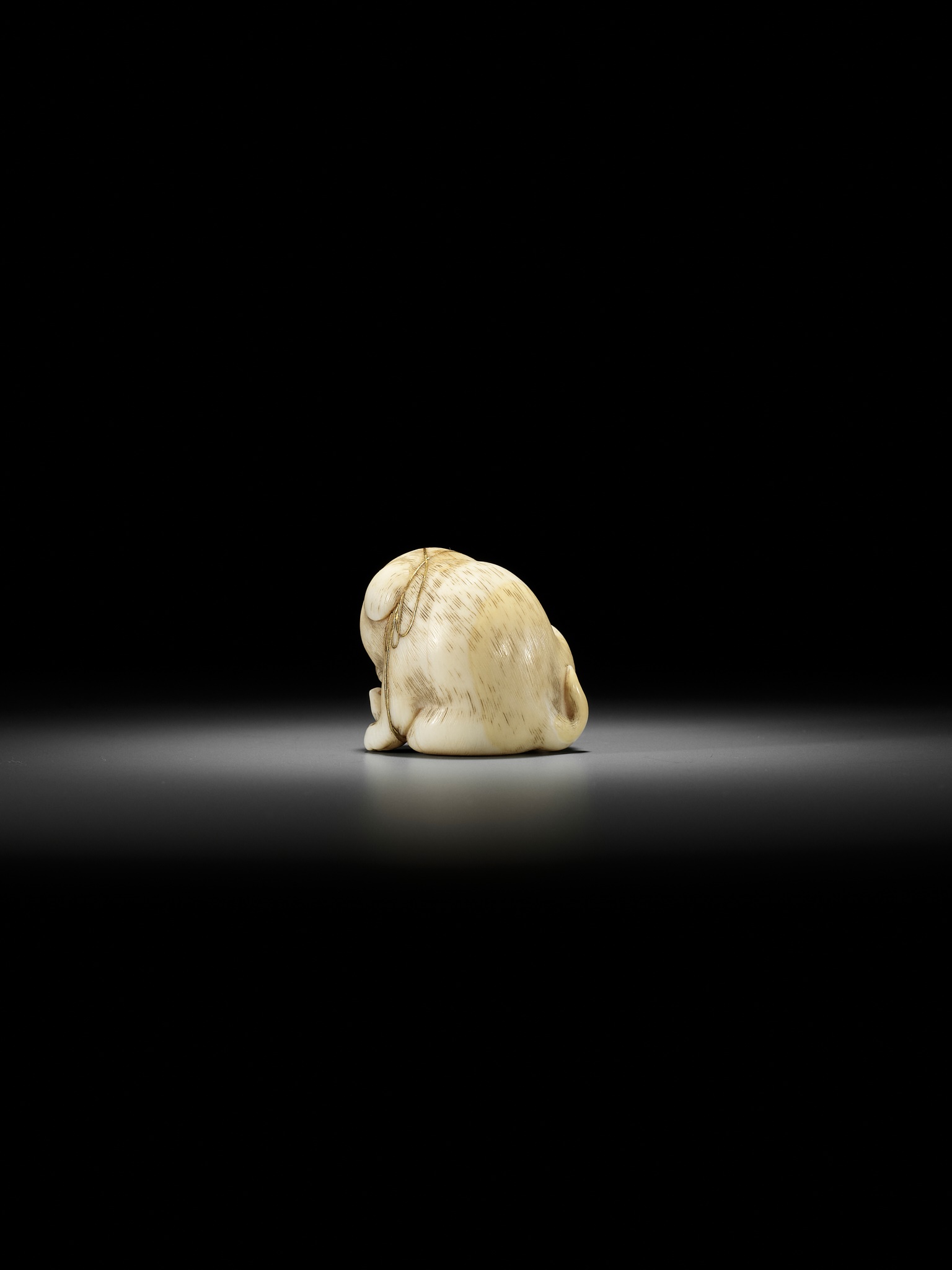 KAIGYOKUSAI MASATSUGU: A SUPERB IVORY NETSUKE OF A PUPPY WITH TOY BIRD - Image 10 of 16