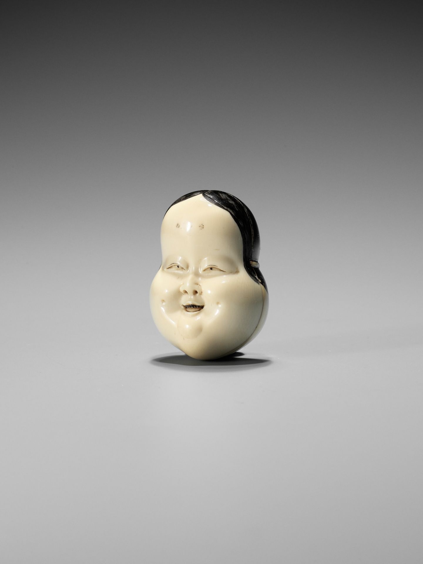 YOZEI: A RARE LACQUERED IVORY HAKO (BOX) AND COVER IN THE FORM OF AN OKAME MASK, DATED 1705 - Image 6 of 10