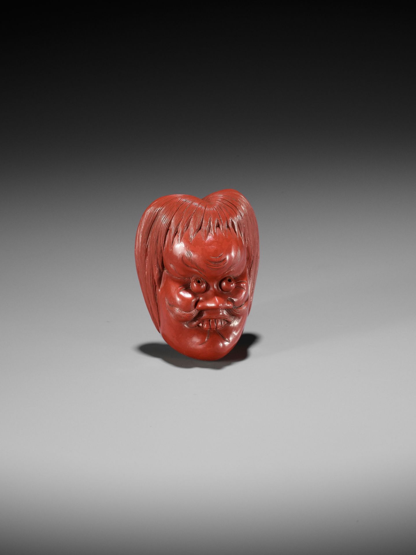 HOKEI: A MASTERFUL TSUISHU (RED LACQUER) MASK NETSUKE OF A SHOJO - Bild 2 aus 13