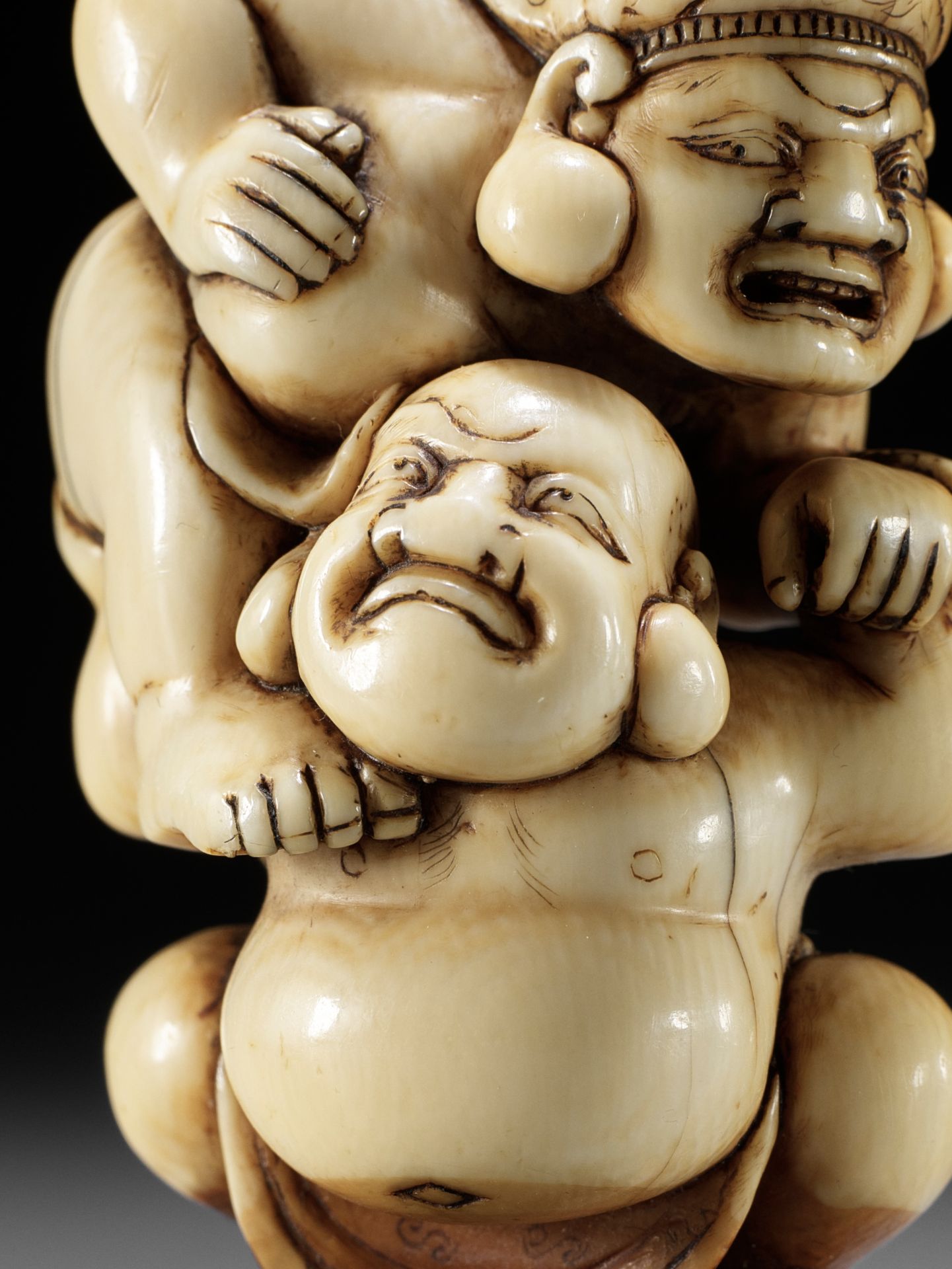 AN IVORY NETSUKE OF HOTEI AND DAIKOKU WRESTLING - Image 11 of 13