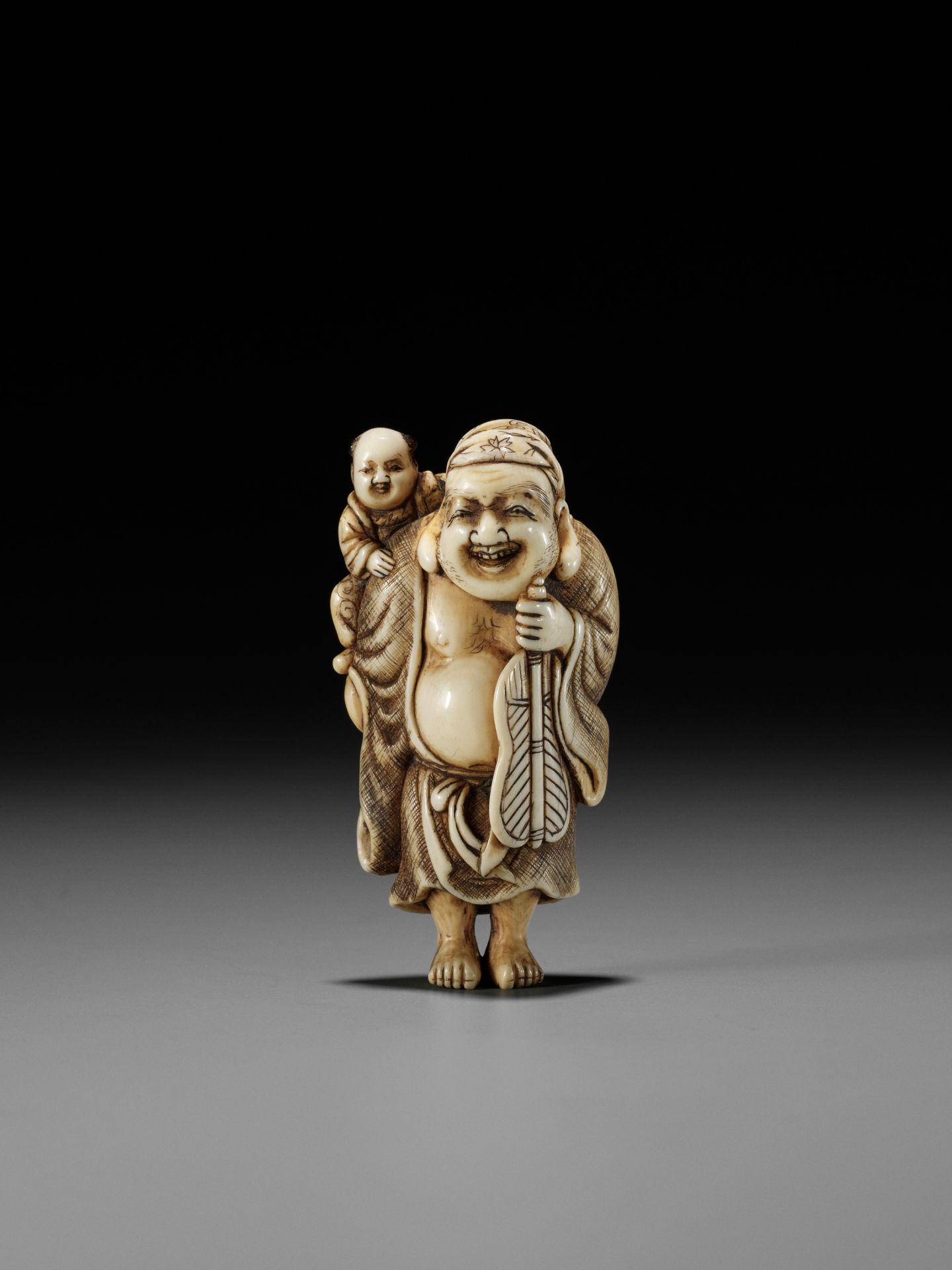 OKAKOTO: AN IVORY NETSUKE OF HOTEI WITH KARAKO - Image 3 of 12