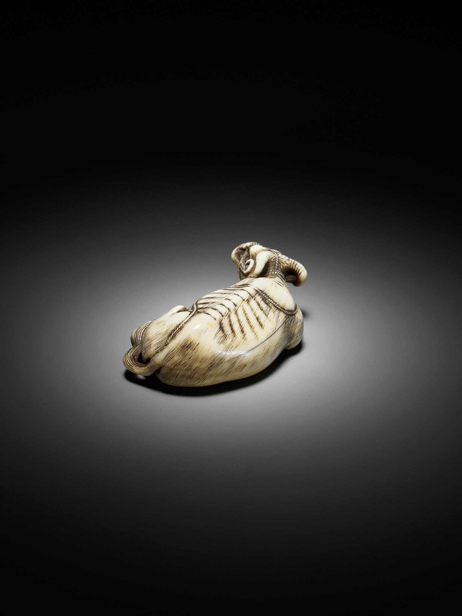 TOMOTADA: A SUPERB IVORY NETSUKE OF A RECUMBENT COW - Image 10 of 18