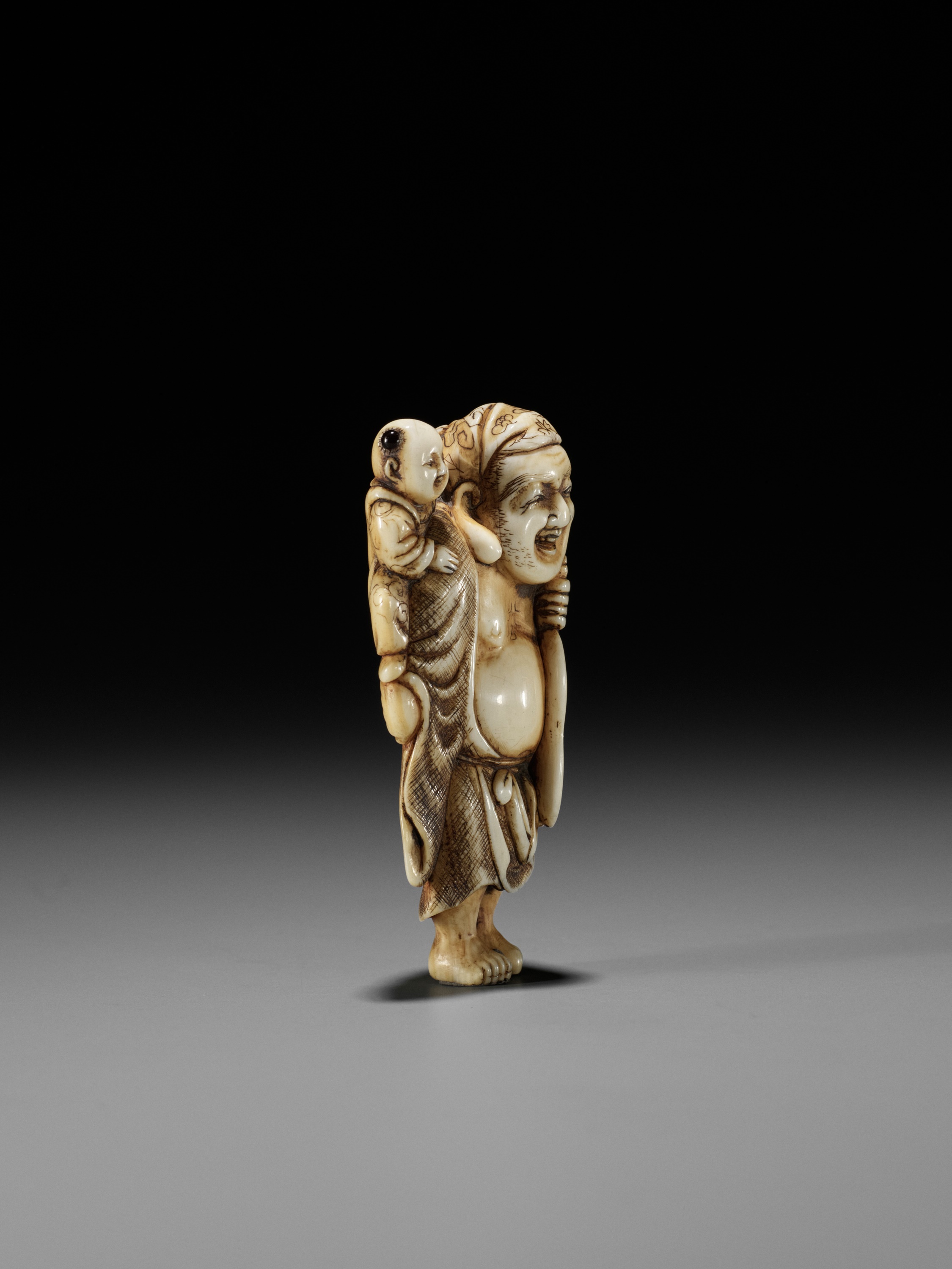 OKAKOTO: AN IVORY NETSUKE OF HOTEI WITH KARAKO - Image 7 of 12