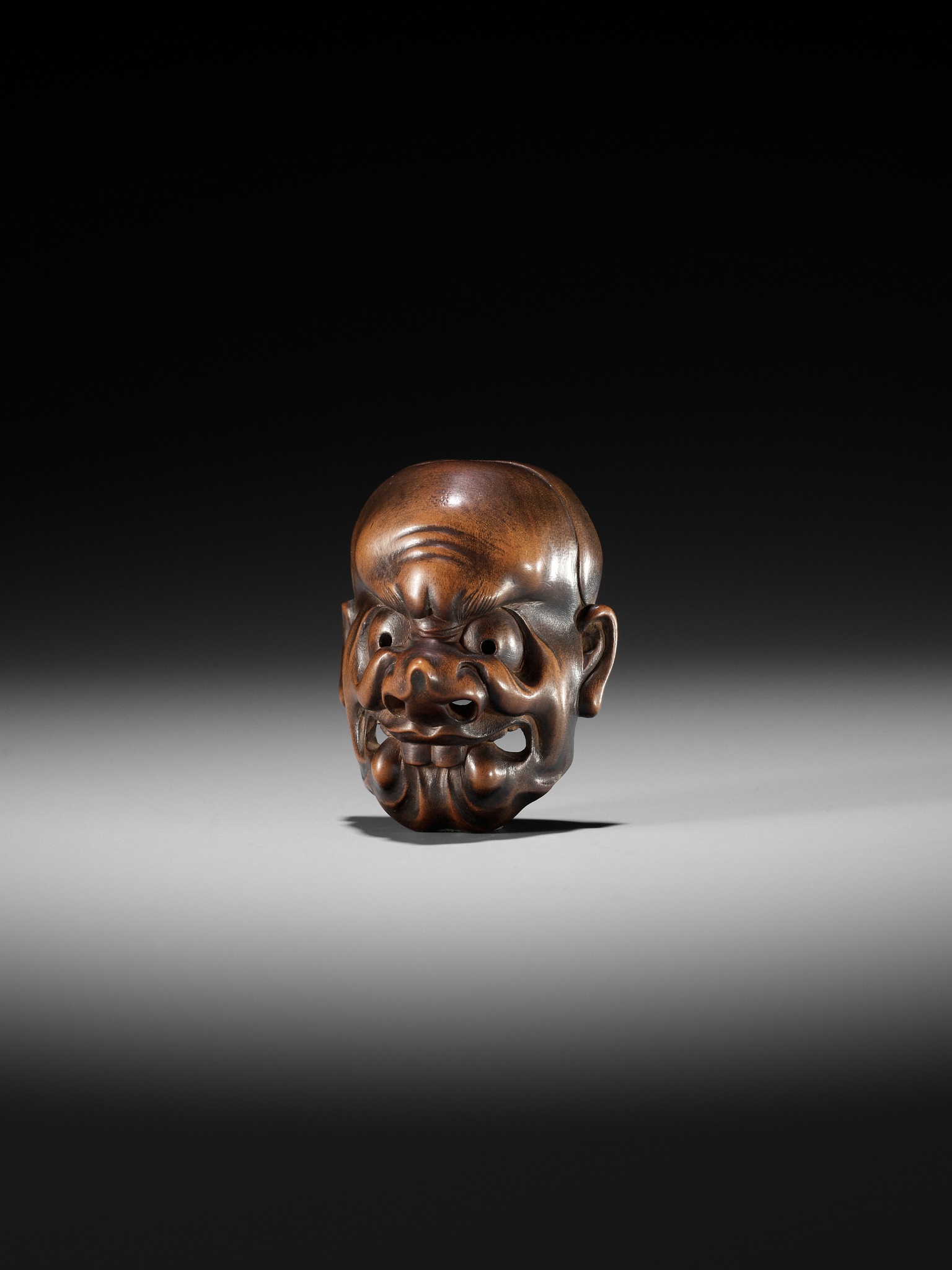 KOKEISAI SANSHO: A SUPERB STAINED WOOD MASK NETSUKE OF A GHOUL - Image 6 of 13