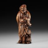 AN EXCEPTIONAL AND RARE WOOD NETSUKE OF RYO TOHIN TAUNTING A DRAGON