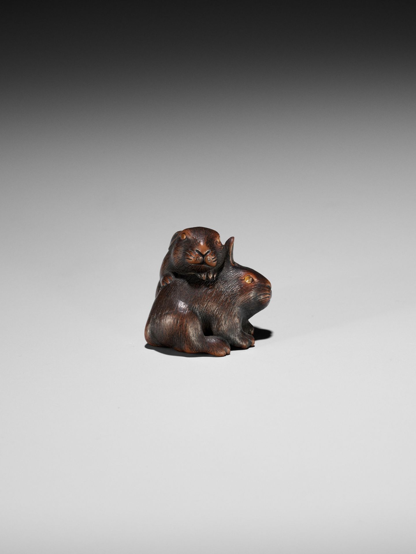 MASATADA: A FINE WOOD NETSUKE OF TWO RABBITS WITH AMBER EYES - Image 9 of 11