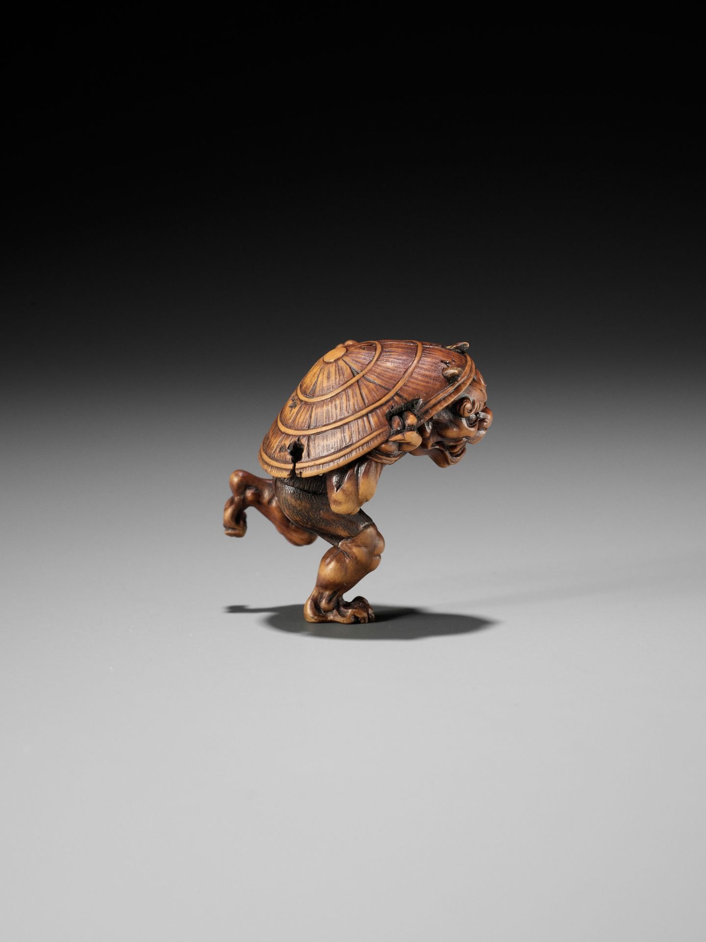 A WOOD NETSUKE OF AN ONI AT SETSUBUN, ATTRIBUTED TO ROKKO - Image 2 of 9