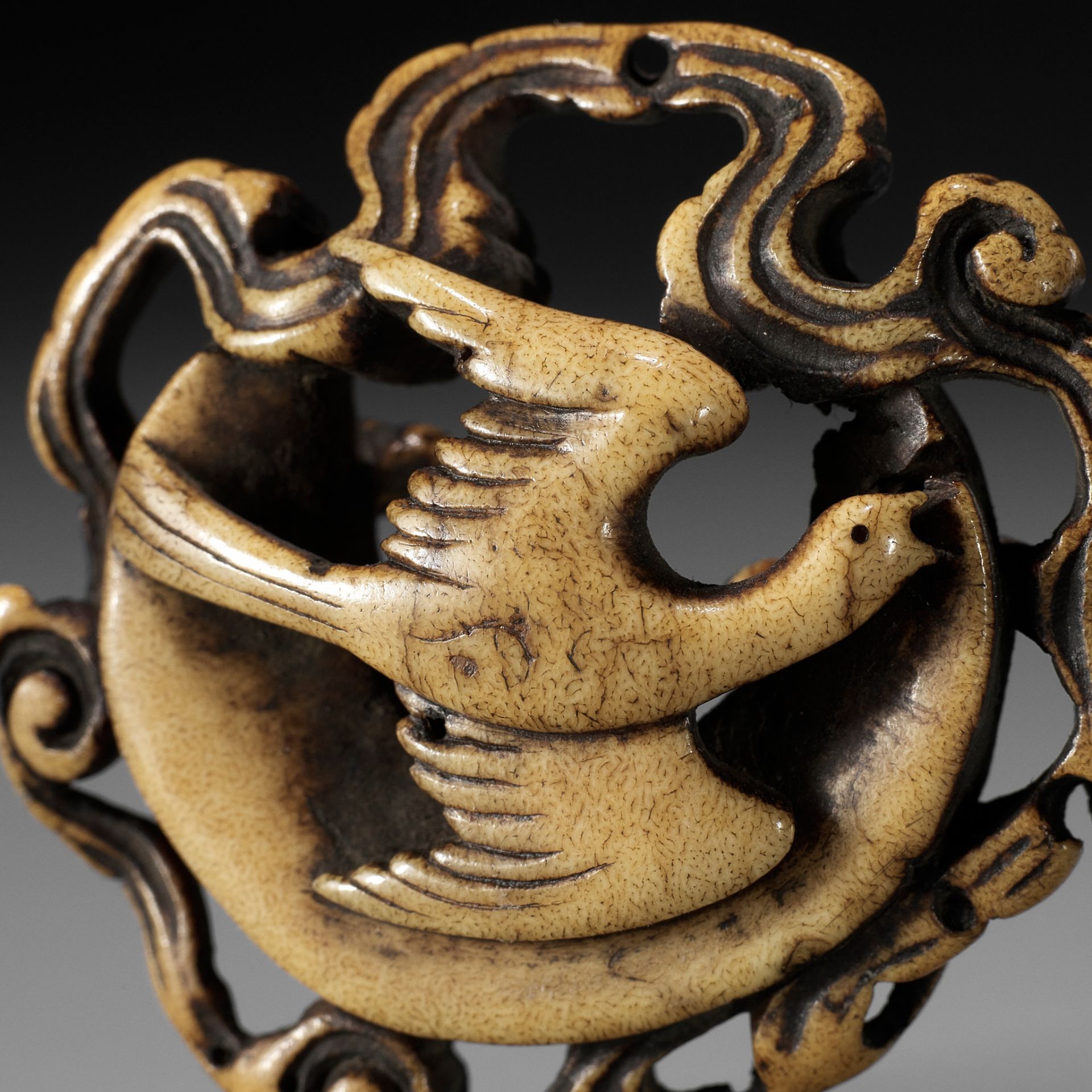 A FINE STAG ANTLER RYUSA MANJU NETSUKE OF A CUCKOO AND MOON, ATTRIBUTED TO RENSAI