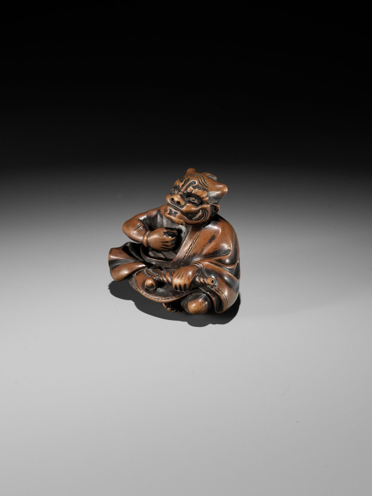 MASAYUKI: A FINE WOOD NETSUKE OF A SMOKING ONI - Image 5 of 11