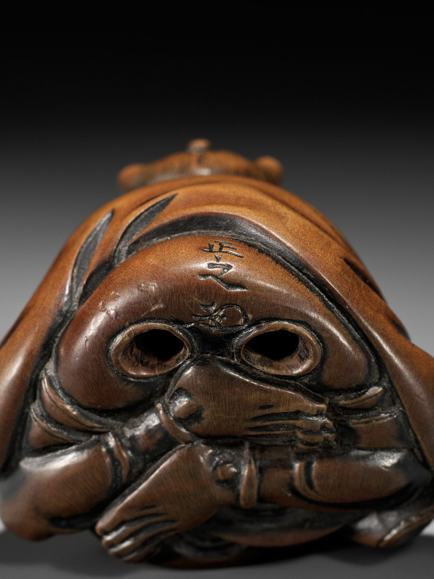 MASAYUKI: A FINE WOOD NETSUKE OF A SMOKING ONI - Image 11 of 11