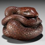 AN EXCEPTIONAL AND LARGE WOOD NETSUKE OF A SNAKE, ATTRIBUTED TO OKATOMO