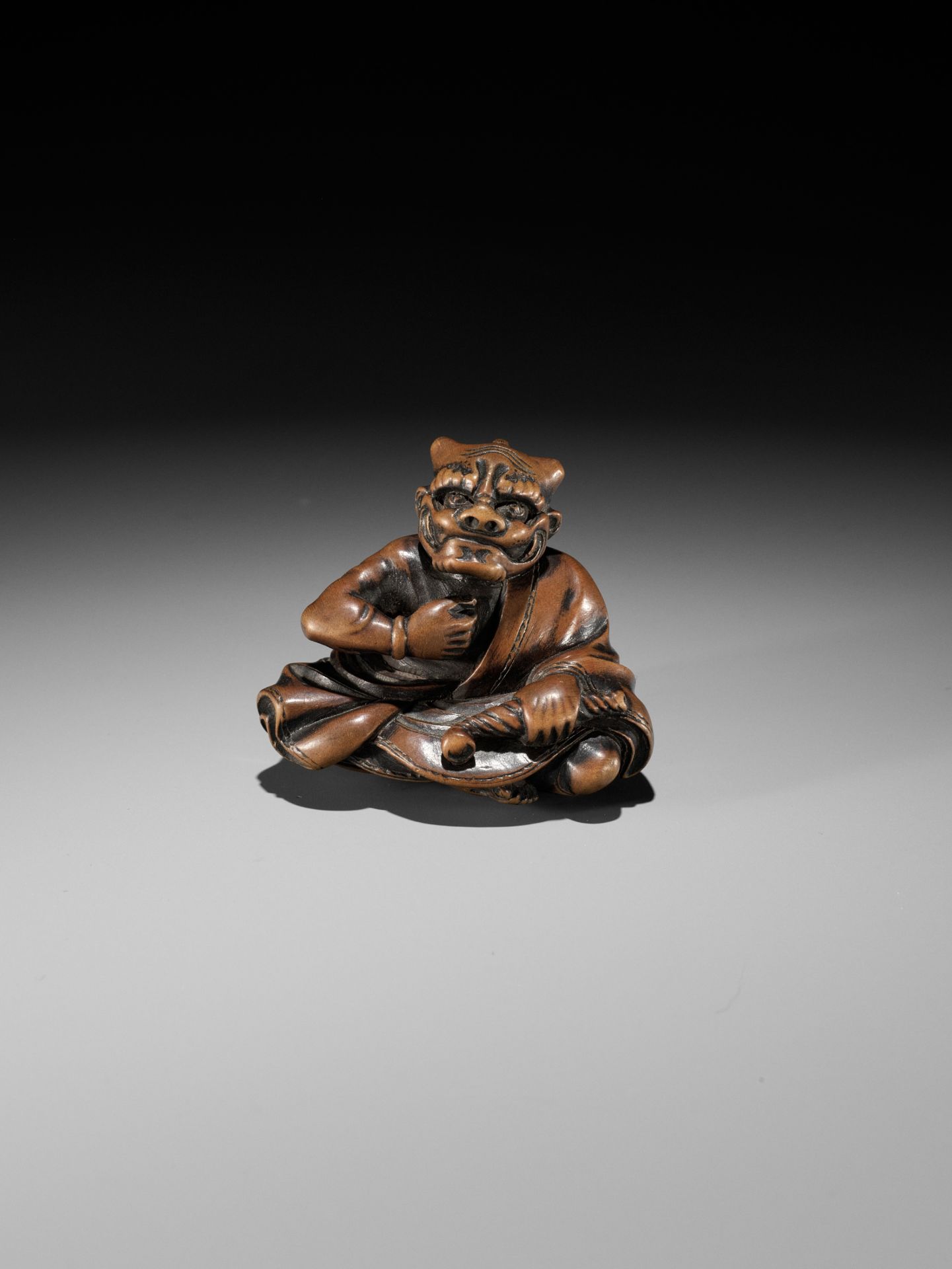 MASAYUKI: A FINE WOOD NETSUKE OF A SMOKING ONI - Image 4 of 11