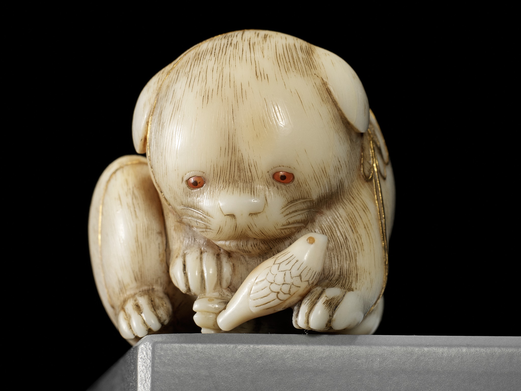 KAIGYOKUSAI MASATSUGU: A SUPERB IVORY NETSUKE OF A PUPPY WITH TOY BIRD - Image 7 of 16