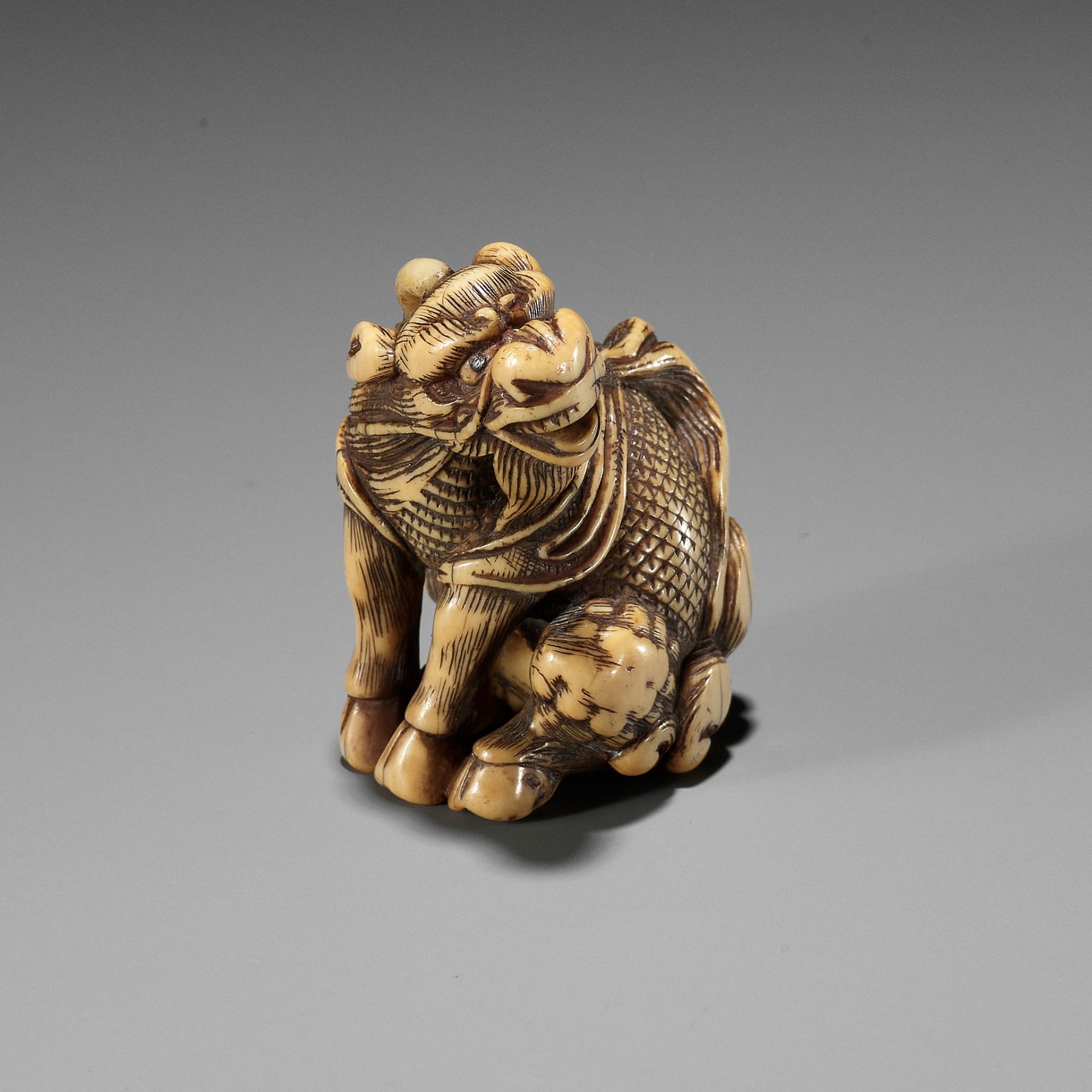 GYOKUZAN: AN IVORY NETSUKE OF A KIRIN