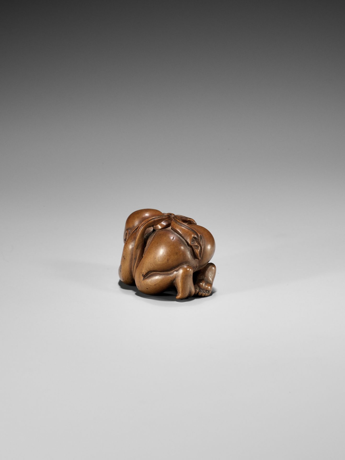 CHIKUUNSAI: A WOOD NETSUKE OF A BABY BOY EATING MOCHI - Image 3 of 12