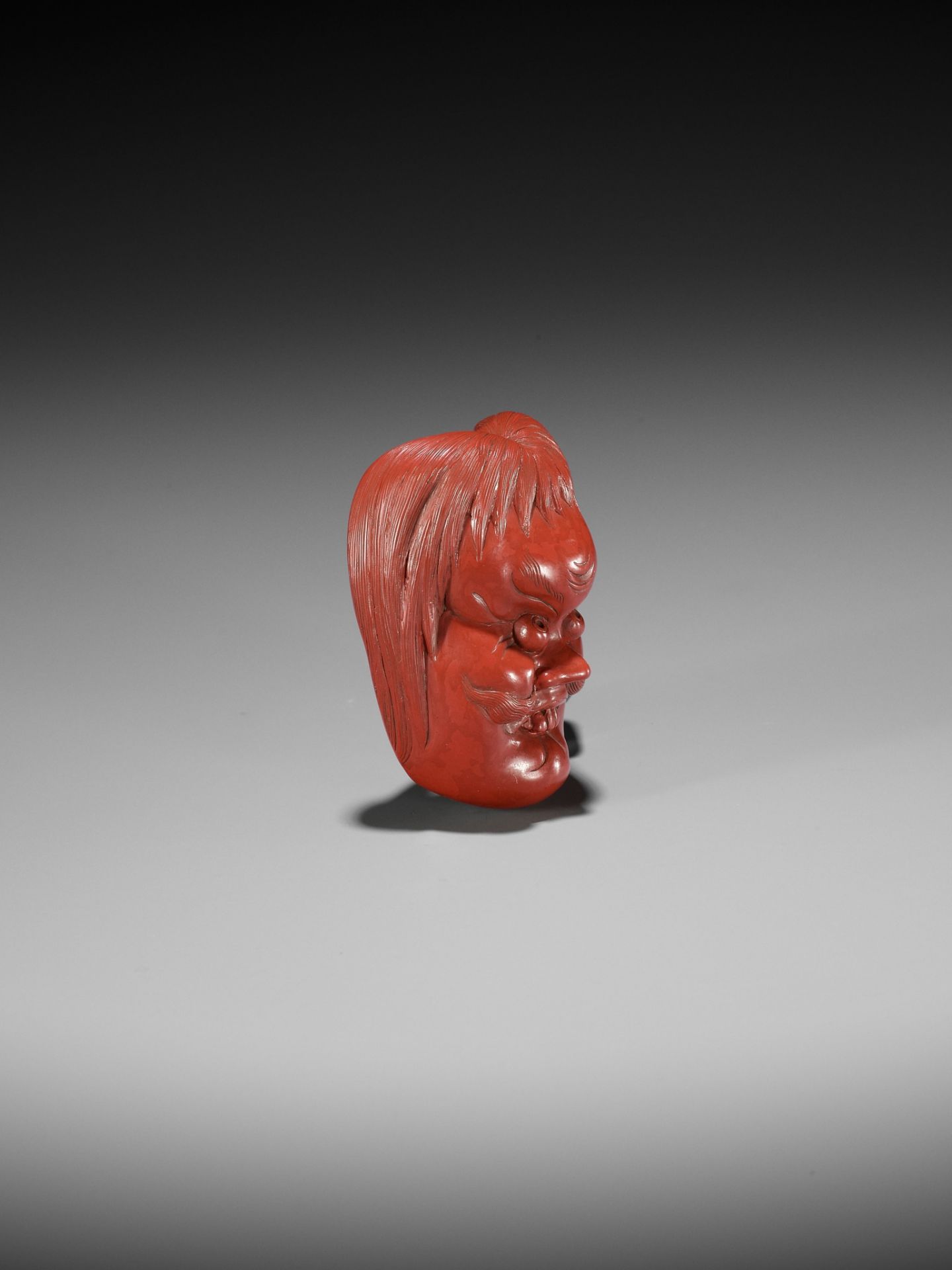 HOKEI: A MASTERFUL TSUISHU (RED LACQUER) MASK NETSUKE OF A SHOJO - Bild 8 aus 13