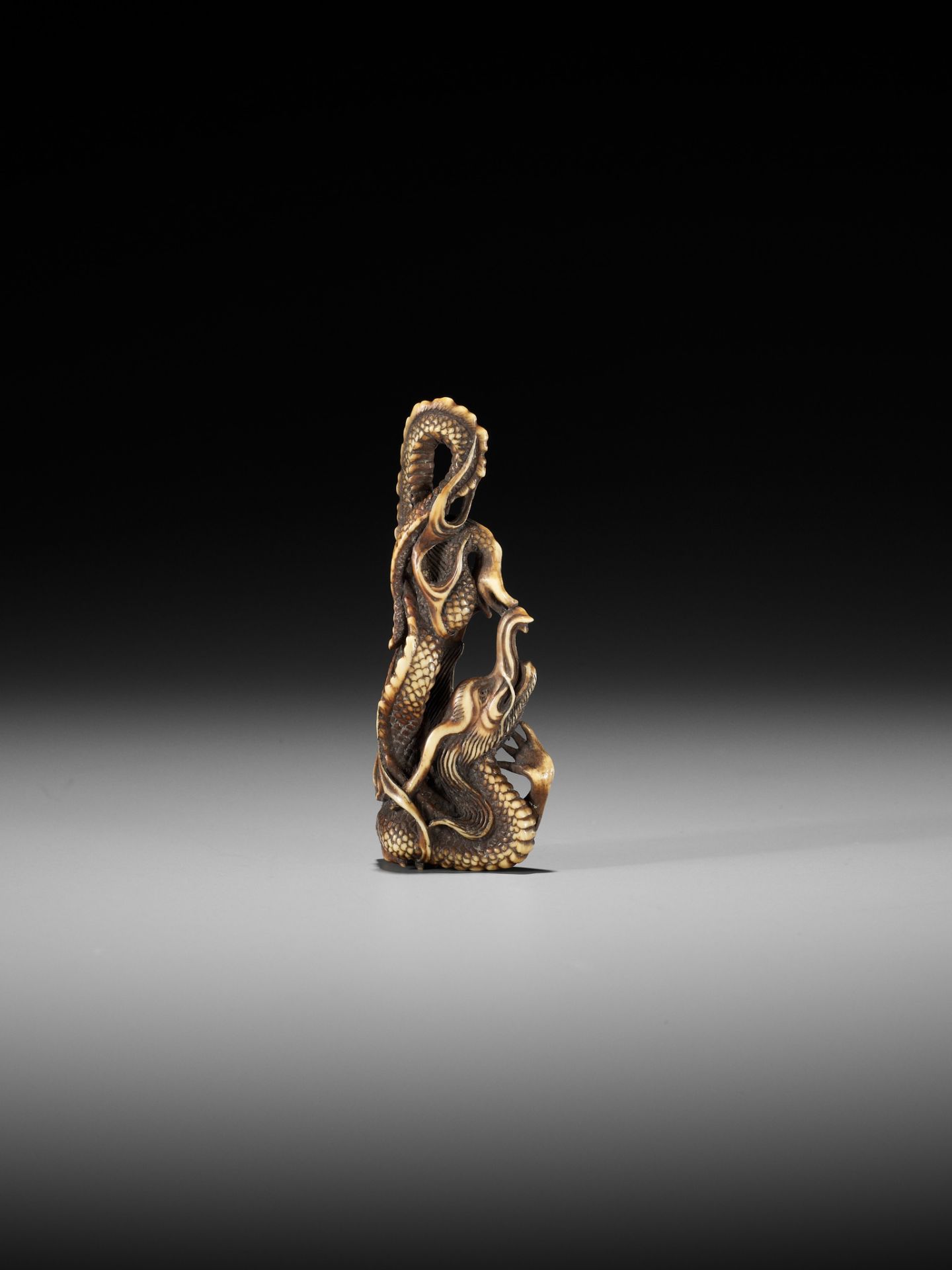 ITTO: A RARE OBIDOME-FORM IVORY NETSUKE OF A WRITHING RAIN DRAGON - Image 9 of 13