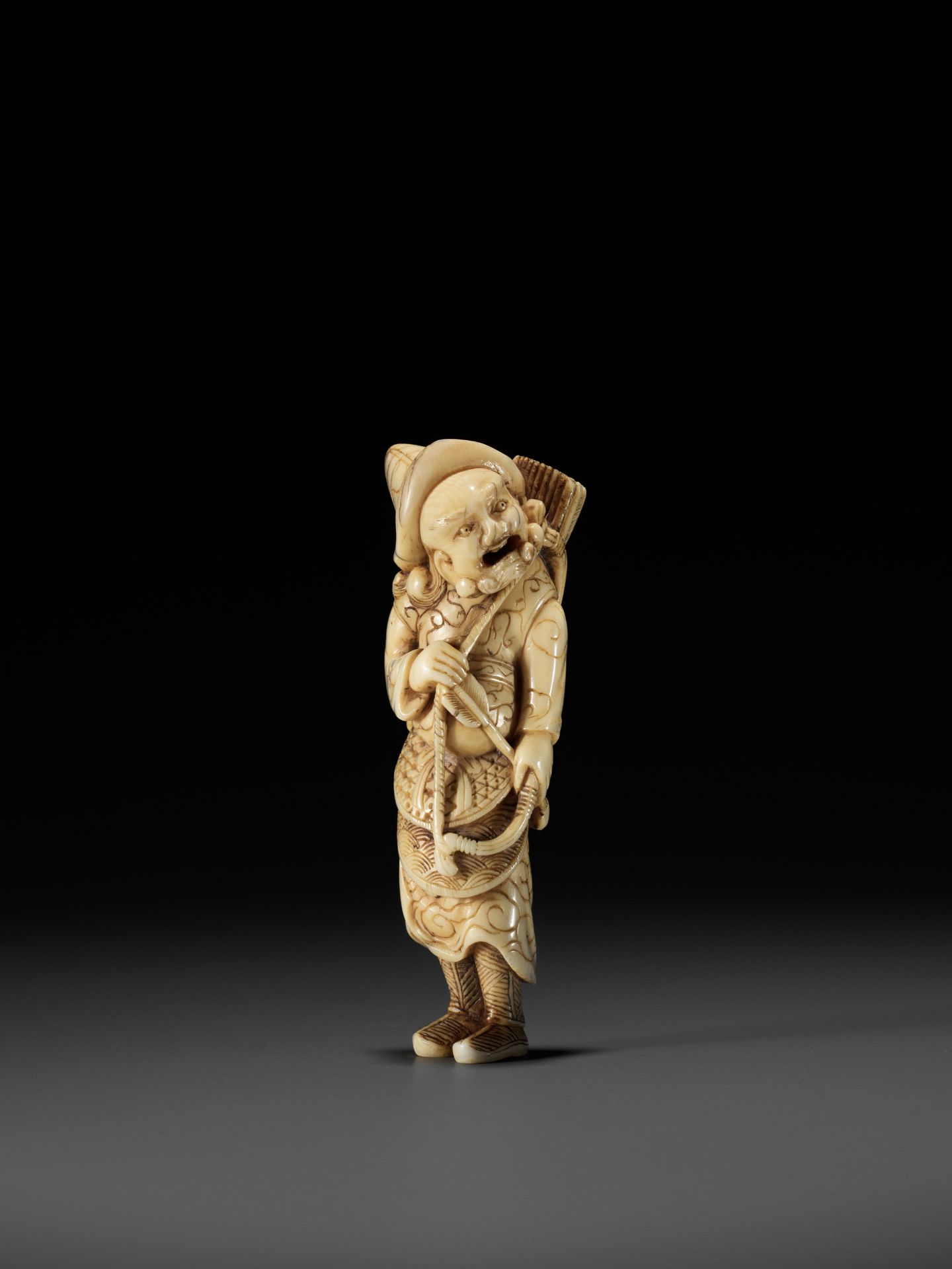 A POWERFUL TALL IVORY NETSUKE OF A TARTAR ARCHER - Image 3 of 11