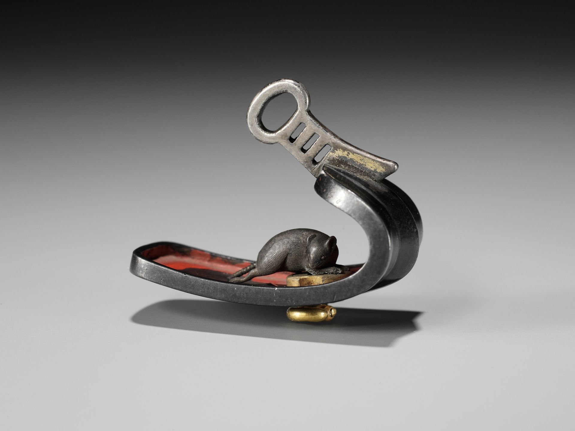 A VERY RARE MIXED-METAL AND LACQUER NETSUKE OF A RAT INSIDE AN ABUMI (STIRRUP)