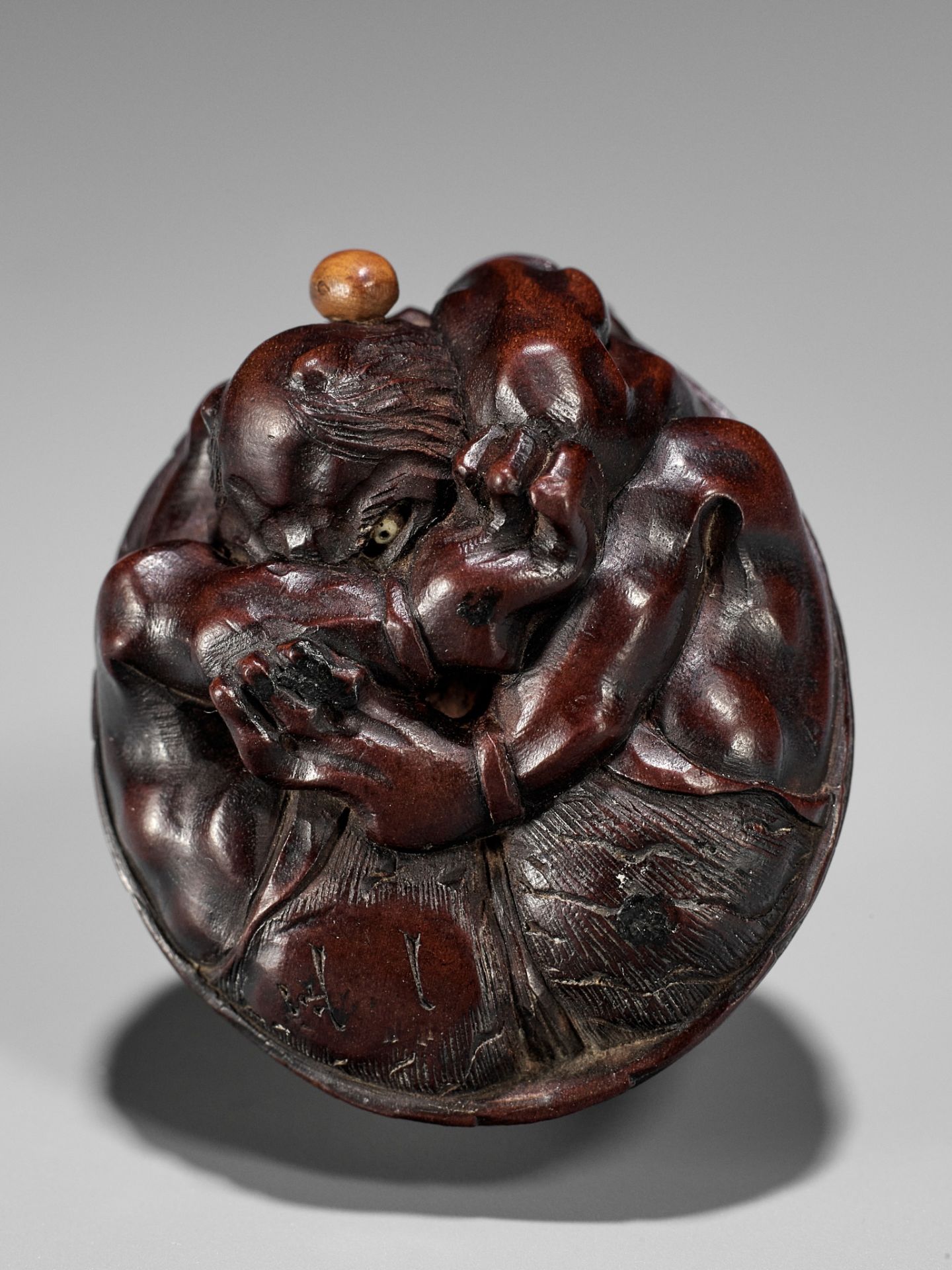 MASAKAZU: A WOOD NETSUKE OF A COWERING ONI DURING SETSUBUN - Image 2 of 13