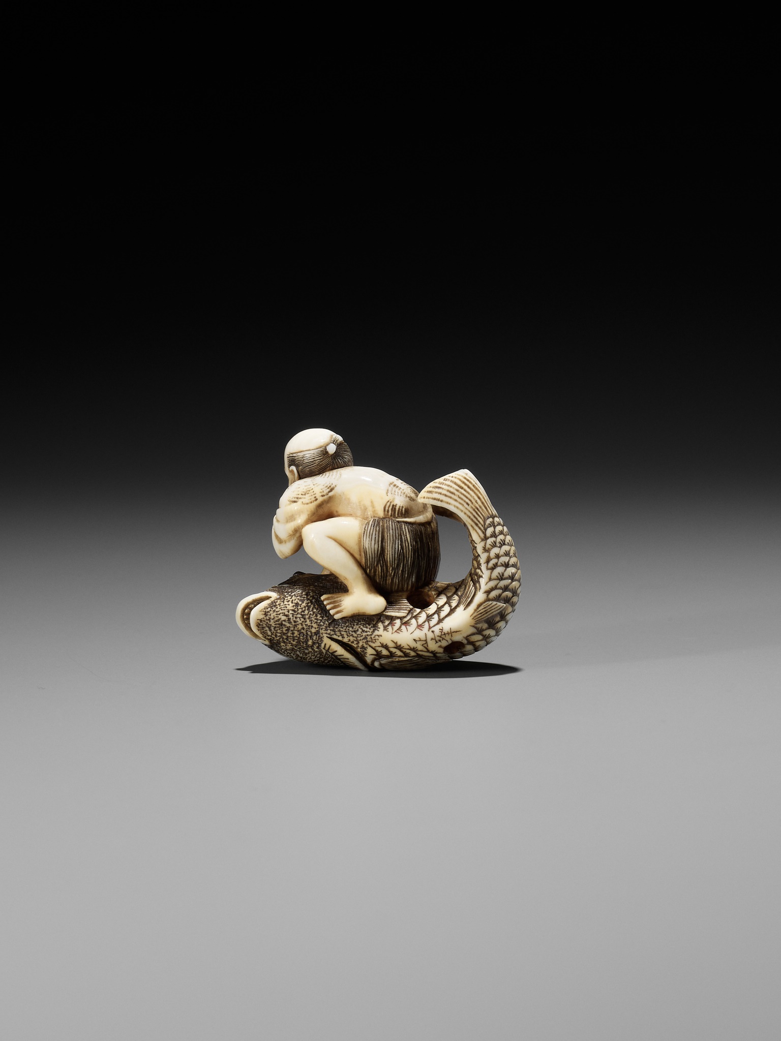 MASAMINE: A FINE OSAKA SCHOOL IVORY NETSUKE OF A FISHERMAN STRUGGLING WITH A HUGE CARP - Image 9 of 14