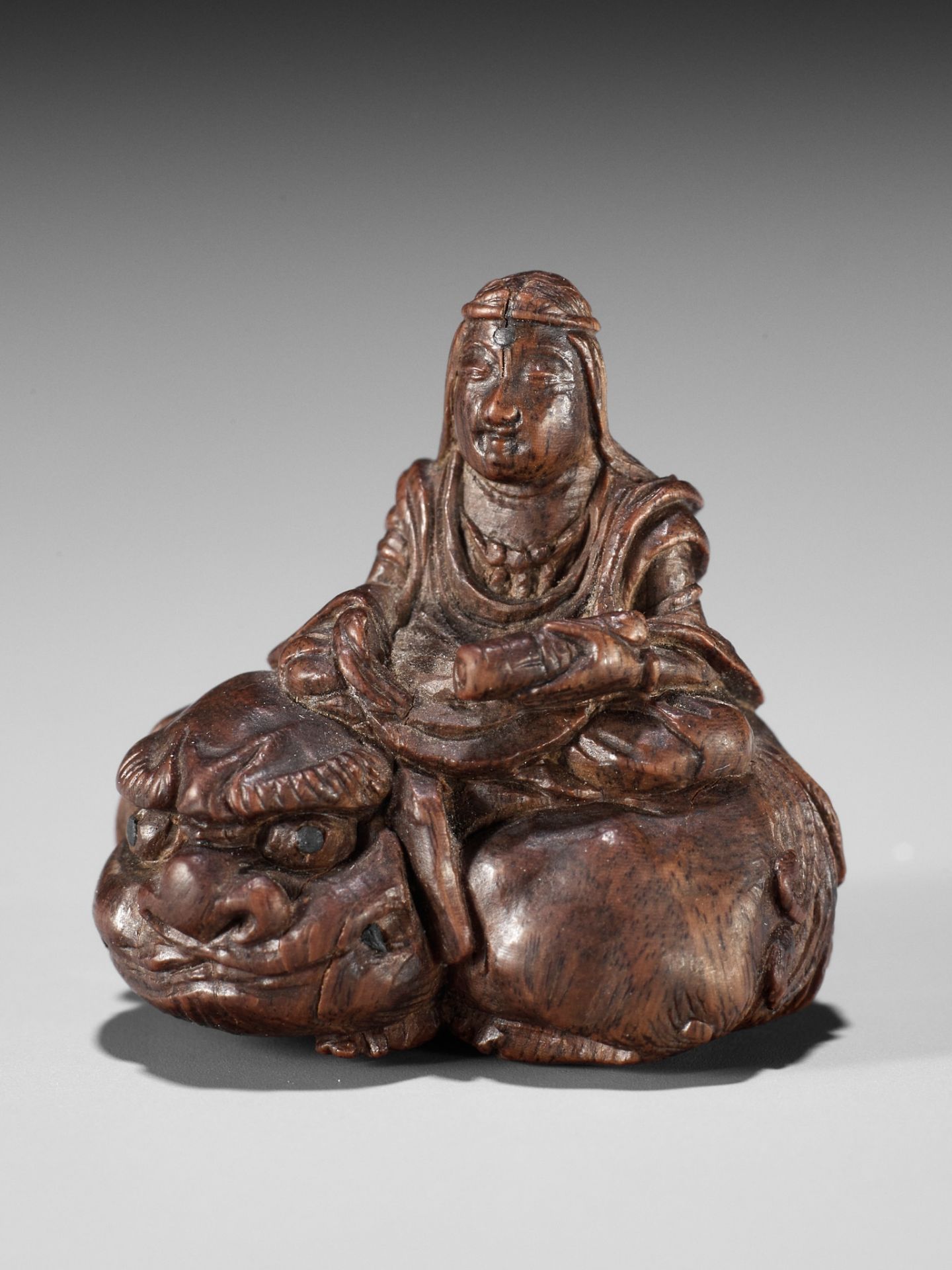 TOSAI: AN EXQUISITE MINIATURE BAMBOO NETSUKE OF MONJU BOSATSU