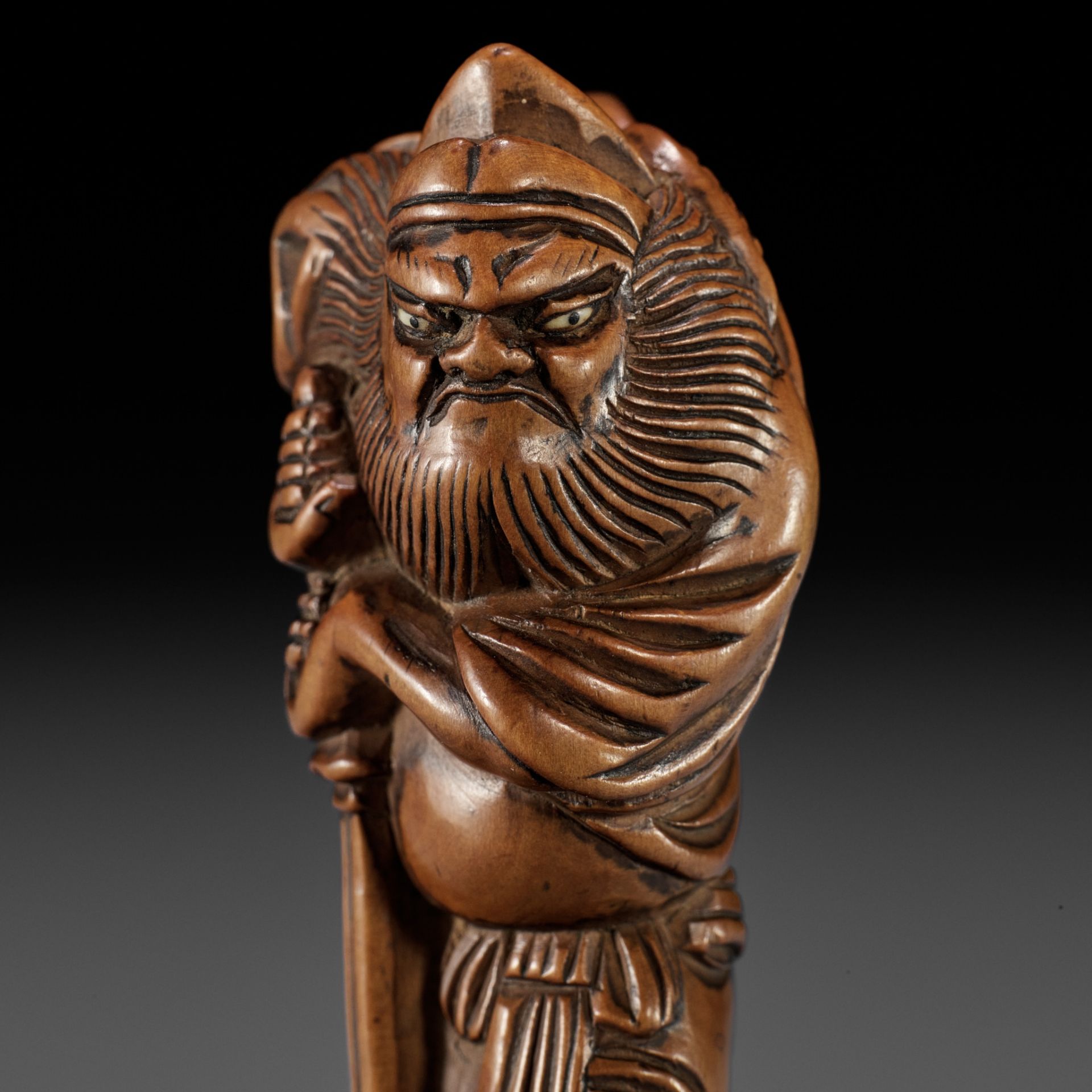 A GOOD WOOD NETSUKE OF SHOKI