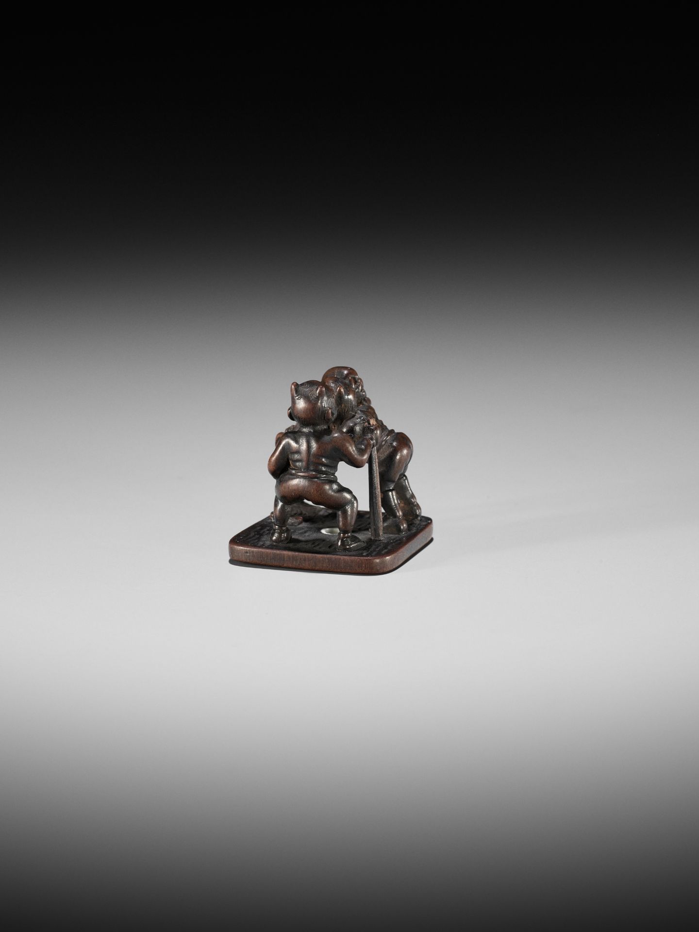 A RARE AND VERY FINE MINIATURE WOOD OKIMONO NETSUKE OF TWO ONI AND A SKELETON (GAIKOTSU) - Image 8 of 10