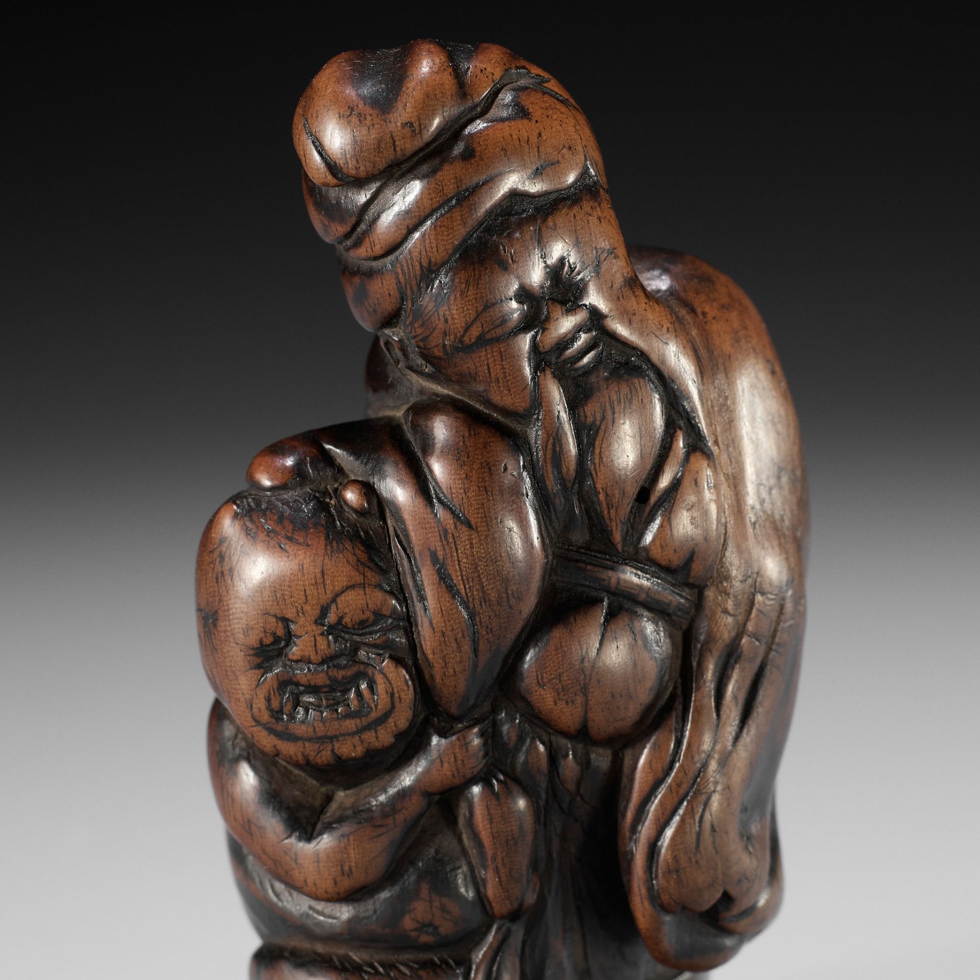 A SUPERB WOOD NETSUKE OF SHOKI AND ONI