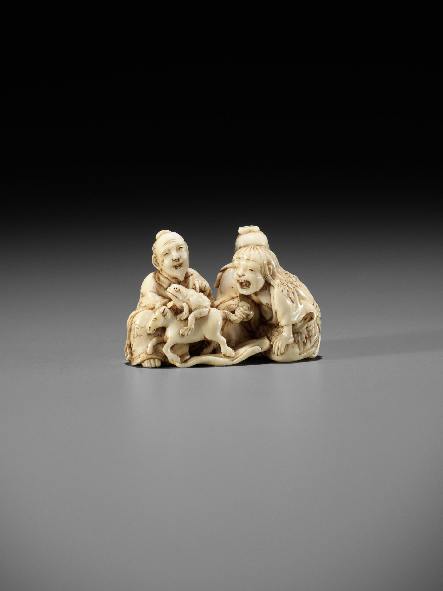 IKKOSAI: AN AMUSING IVORY NETSUKE OF GAMA, CHOKARO, AND TEKKAI SENNIN - Image 7 of 12