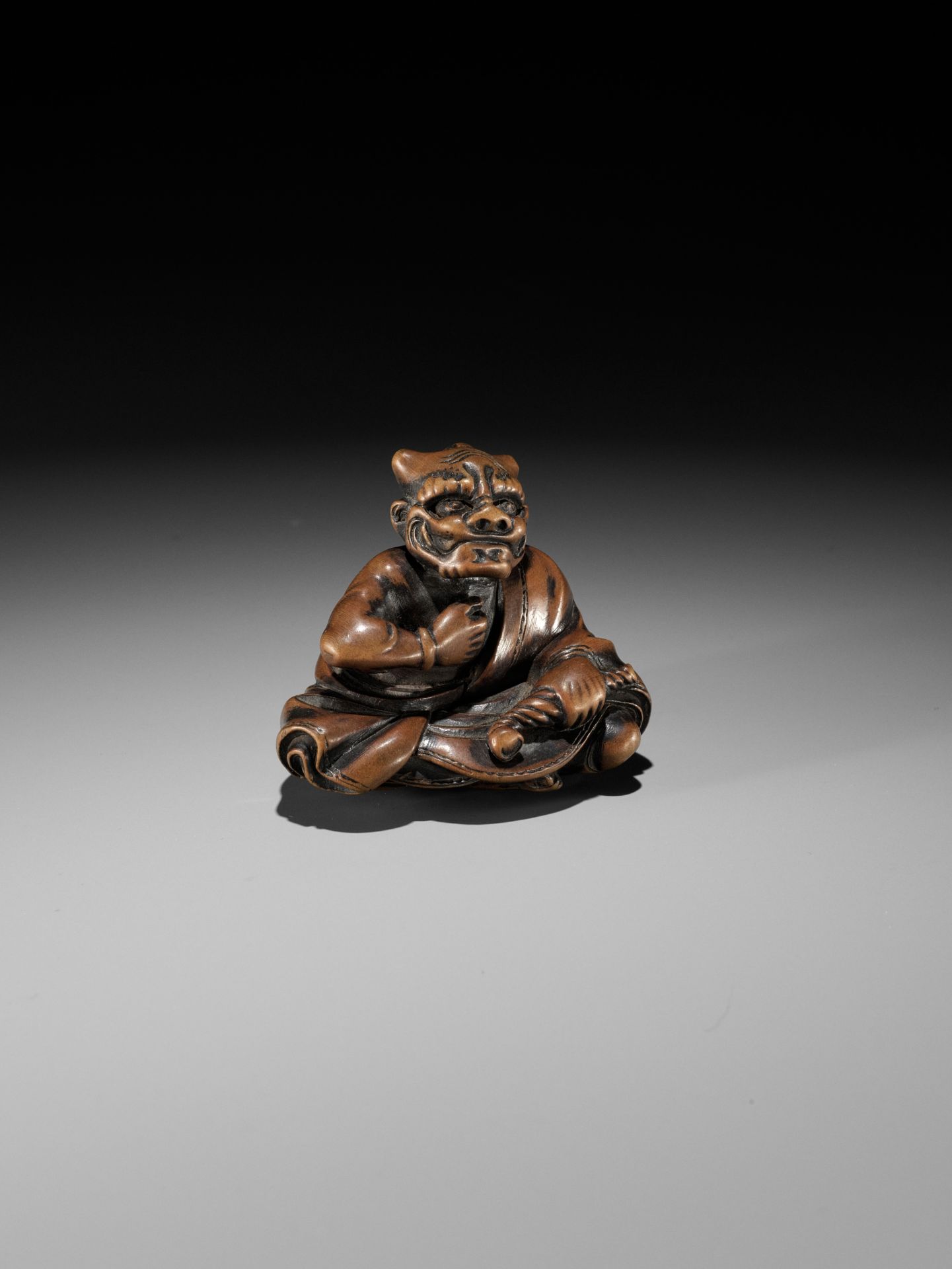 MASAYUKI: A FINE WOOD NETSUKE OF A SMOKING ONI - Image 9 of 11