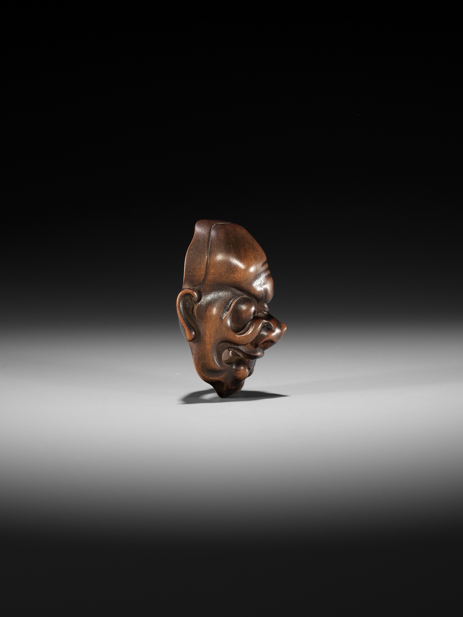 KOKEISAI SANSHO: A SUPERB STAINED WOOD MASK NETSUKE OF A GHOUL - Image 10 of 13