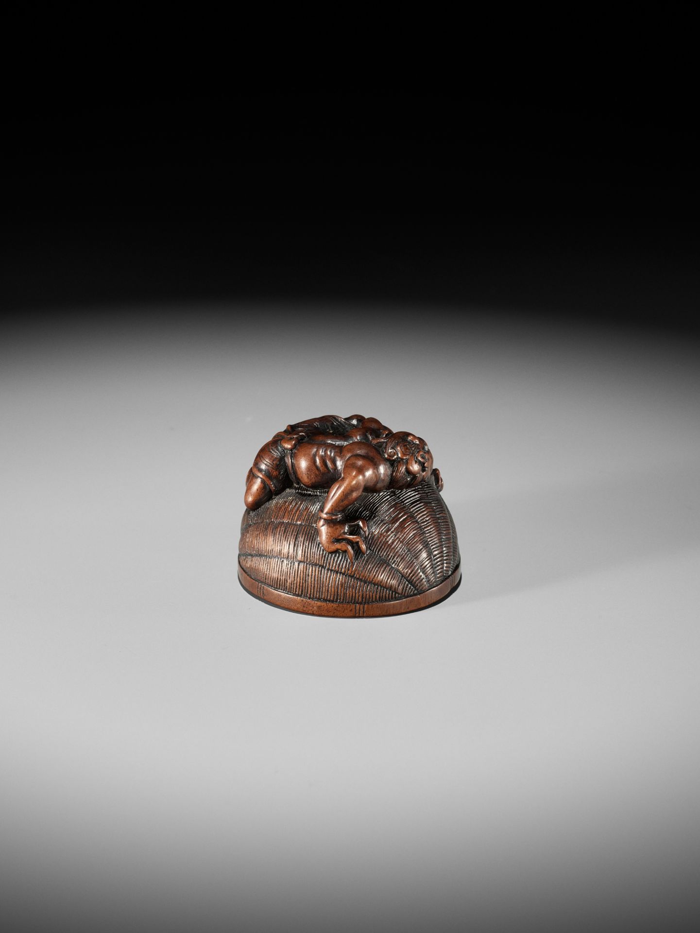 MASANAO: A RARE WOOD NETSUKE OF AN ONI TRAPPING SHOKI - Image 11 of 14