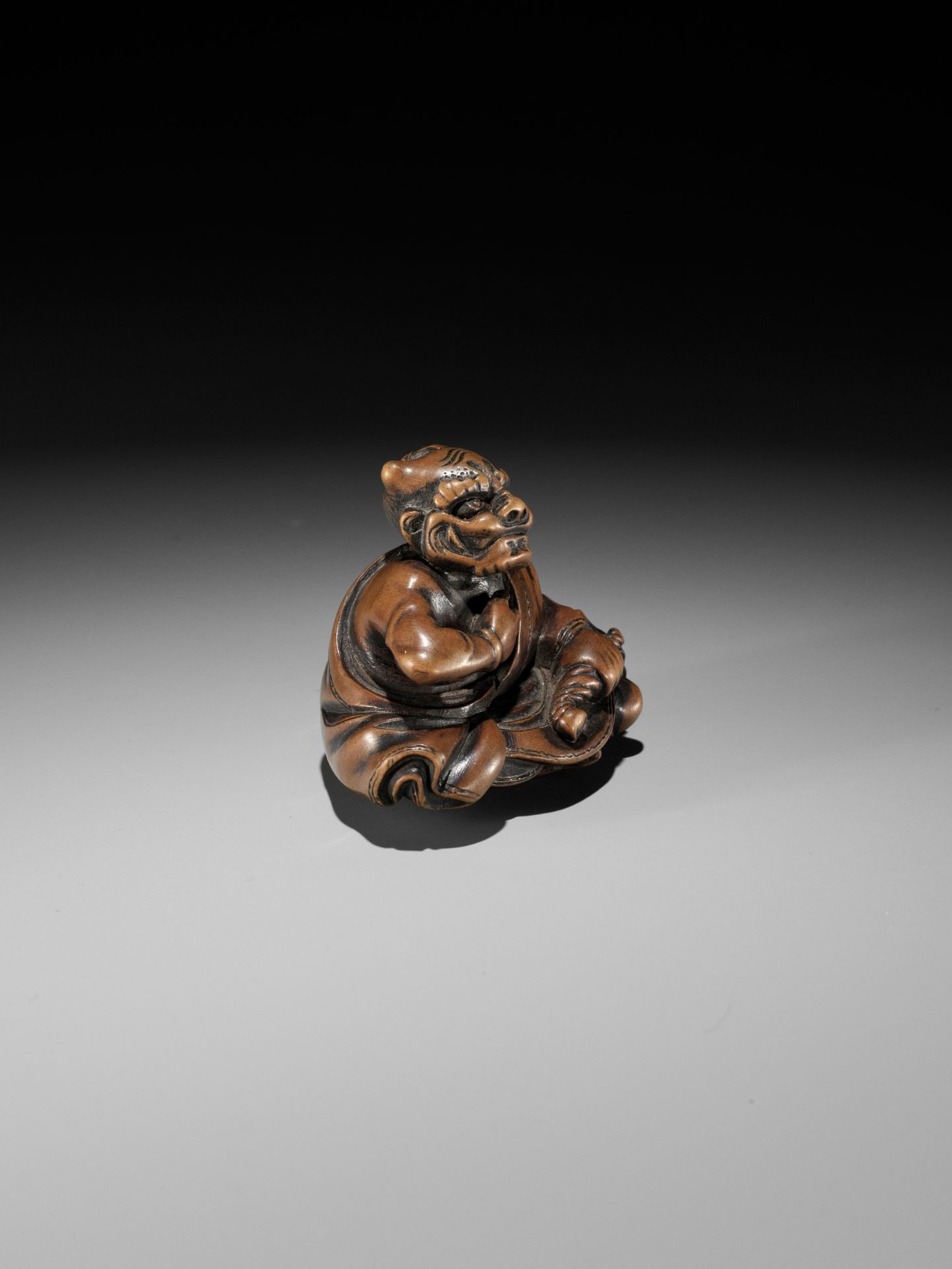 MASAYUKI: A FINE WOOD NETSUKE OF A SMOKING ONI - Image 8 of 11