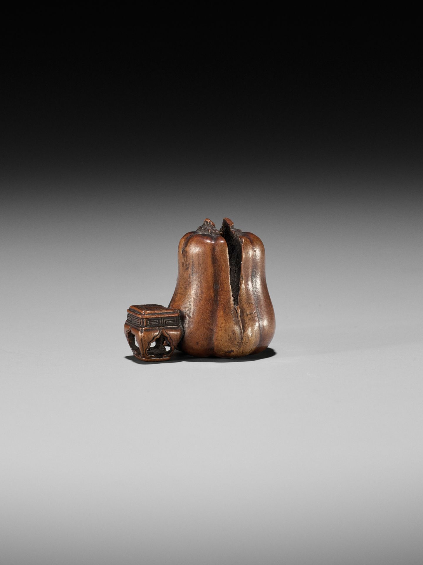 NAOYUKI: AN EXQUISITE MINIATURE WOOD NETSUKE OF A NIO CUTTING THROUGH A GIGANTIC GOURD - Image 5 of 9