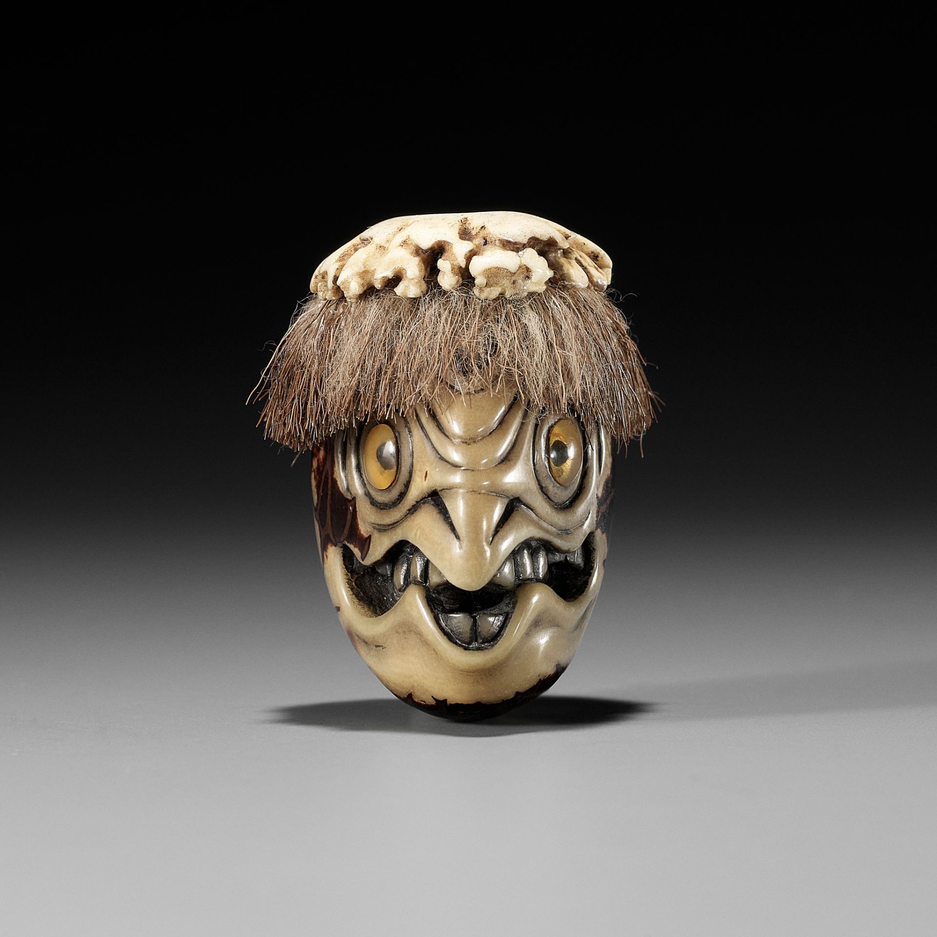 HAKUSAI: A RARE COROZO NUT AND STAG ANTLER NETSUKE OF A KAPPA HEAD