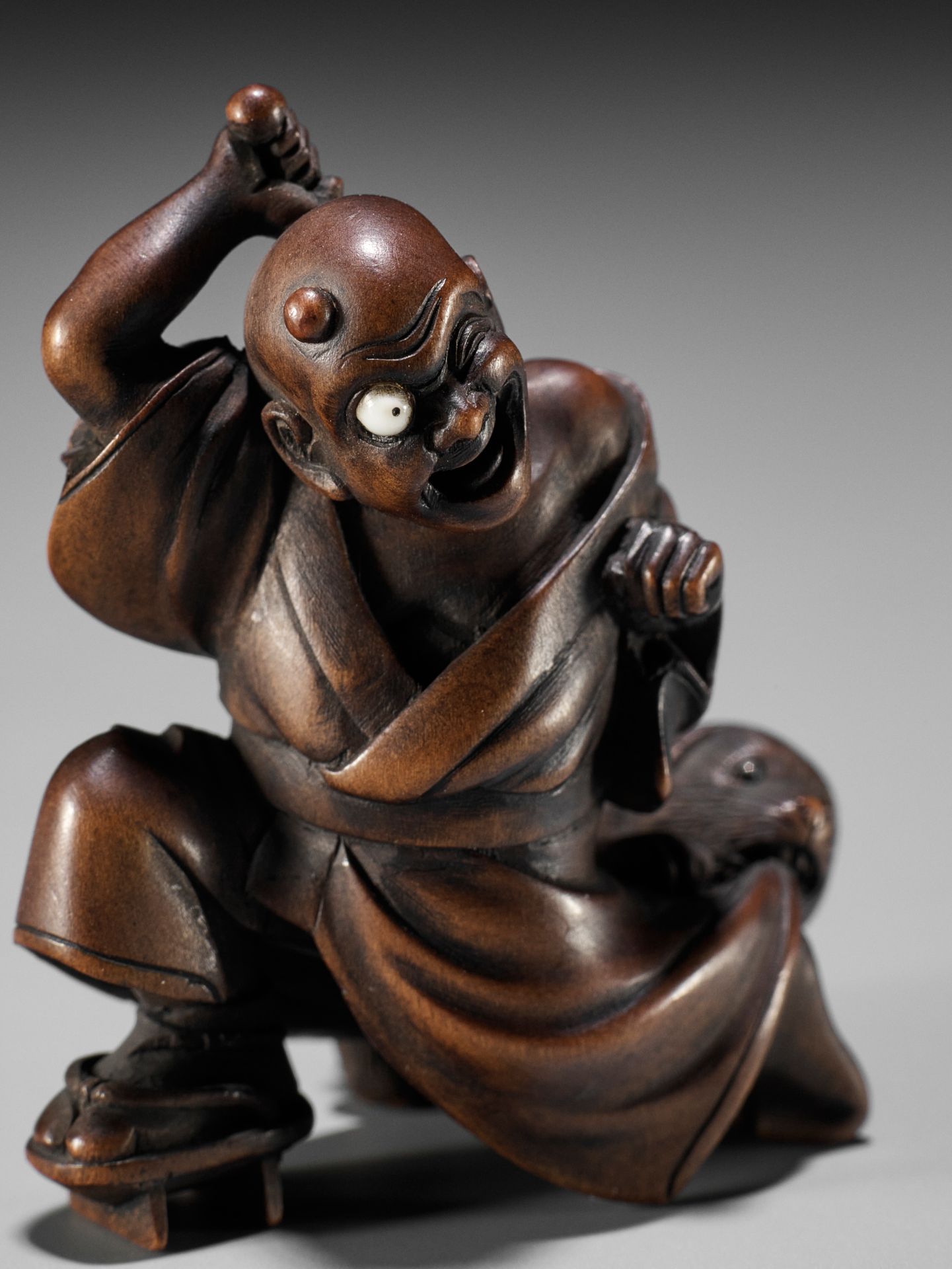 SHOKO: AN AMUSING WOOD NETSUKE OF A BLINDMAN AND PUPPY