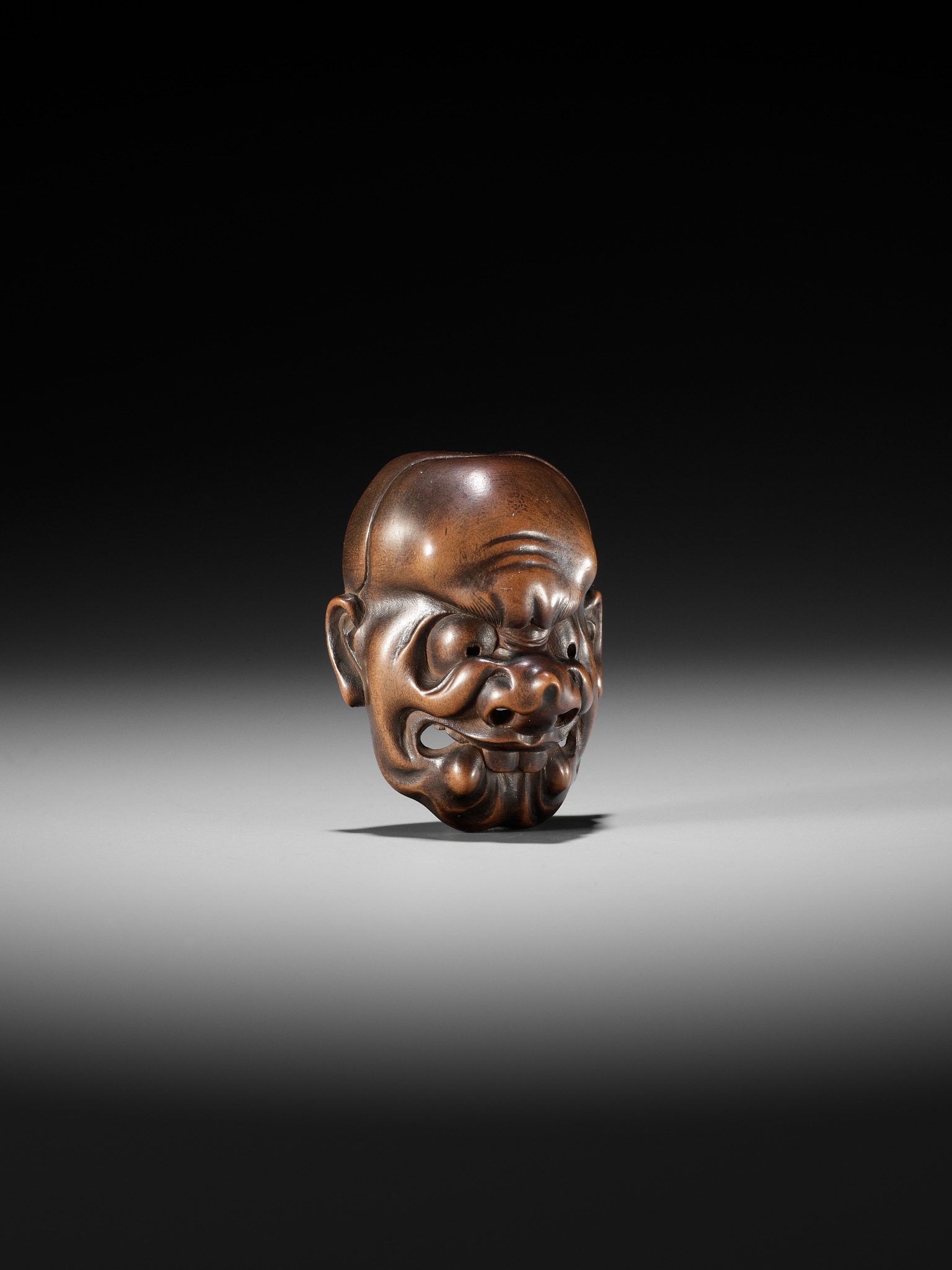 KOKEISAI SANSHO: A SUPERB STAINED WOOD MASK NETSUKE OF A GHOUL - Image 7 of 13