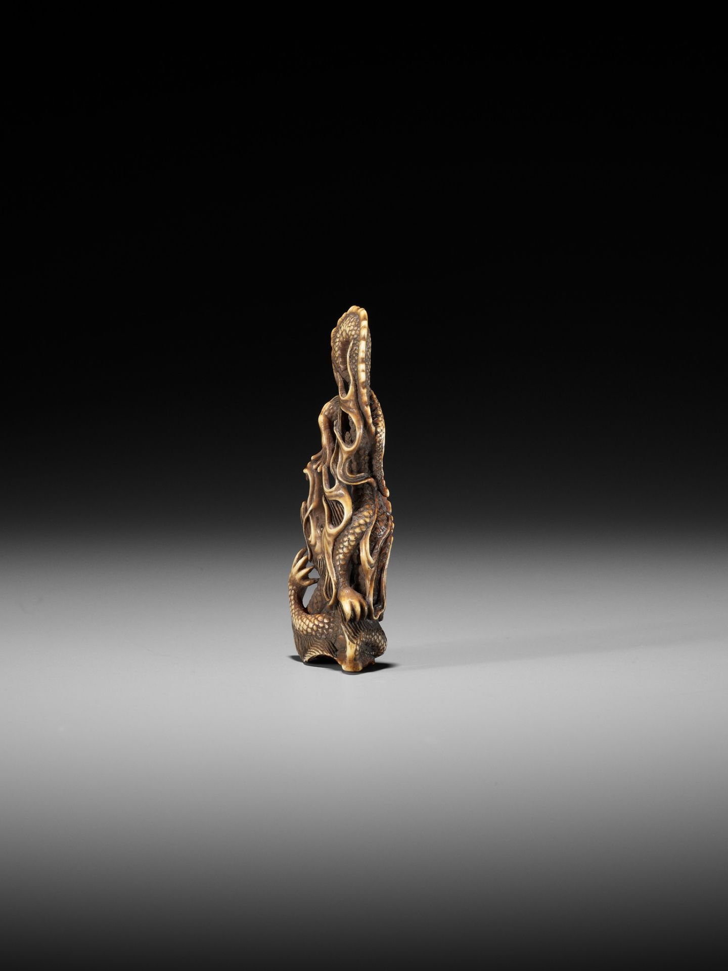 ITTO: A RARE OBIDOME-FORM IVORY NETSUKE OF A WRITHING RAIN DRAGON - Image 7 of 13