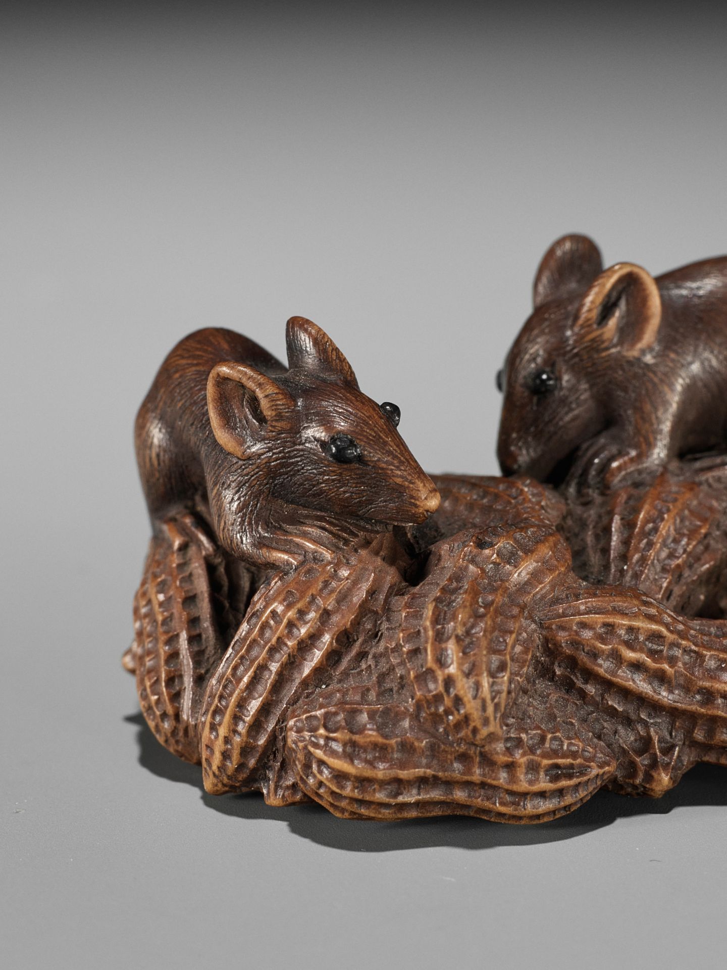 MASANAO: A WOOD NETSUKE OF TWO RATS ON A CLUSTER OF PEANUTS