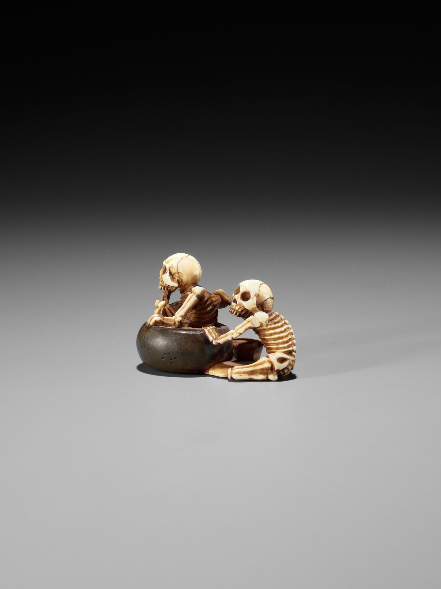 HIDEYUKI: A RARE IVORY AND LACQUER NETSUKE OF BATHING SKELETONS - Image 3 of 11