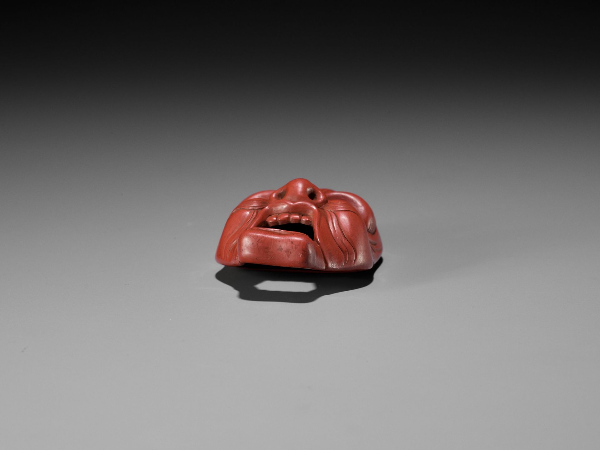 JOKO: A RARE TSUISHU (RED LACQUER) BUGAKU MASK NETSUKE OF GENJORAKU - Image 12 of 12