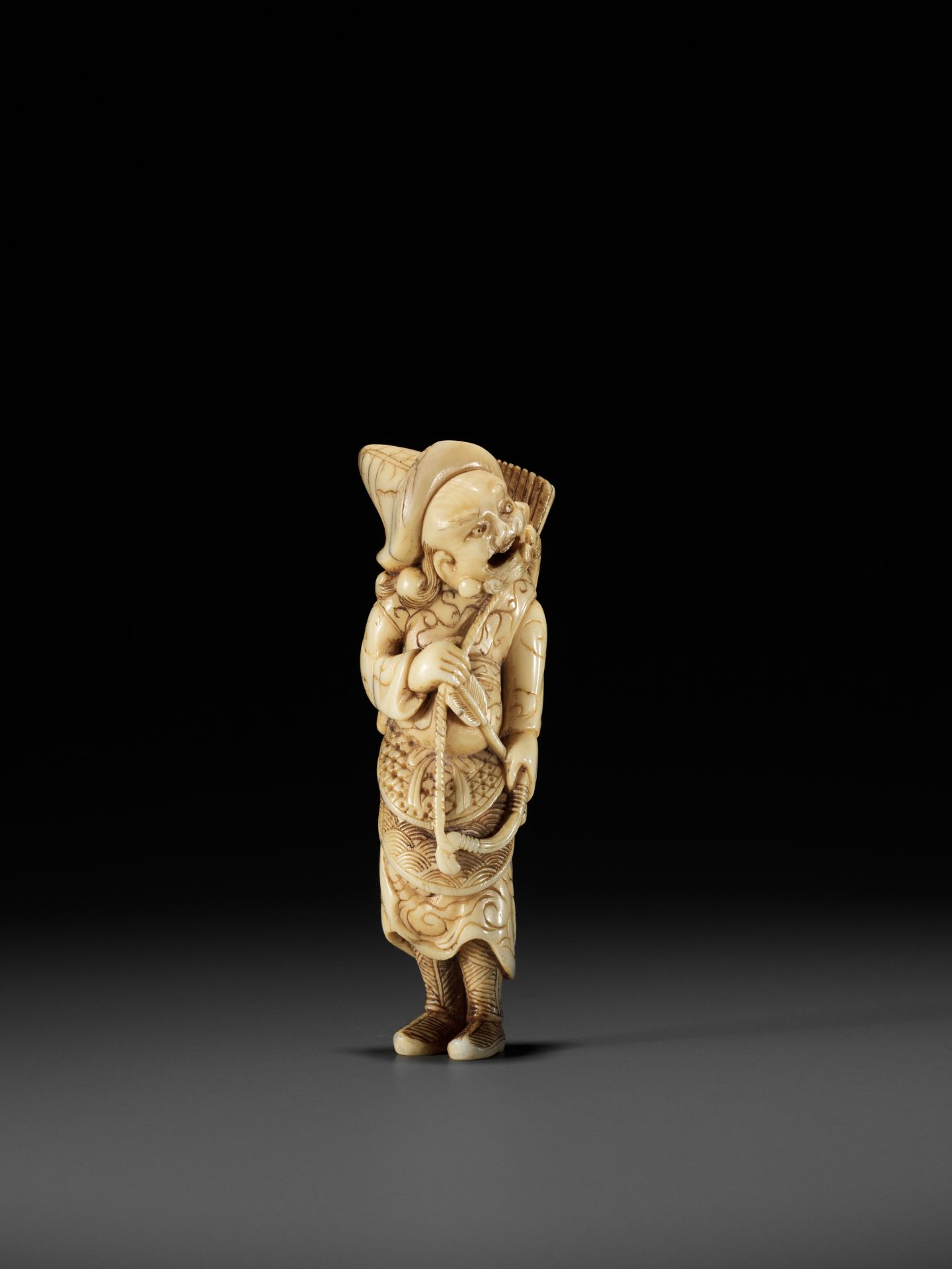 A POWERFUL TALL IVORY NETSUKE OF A TARTAR ARCHER - Image 5 of 11