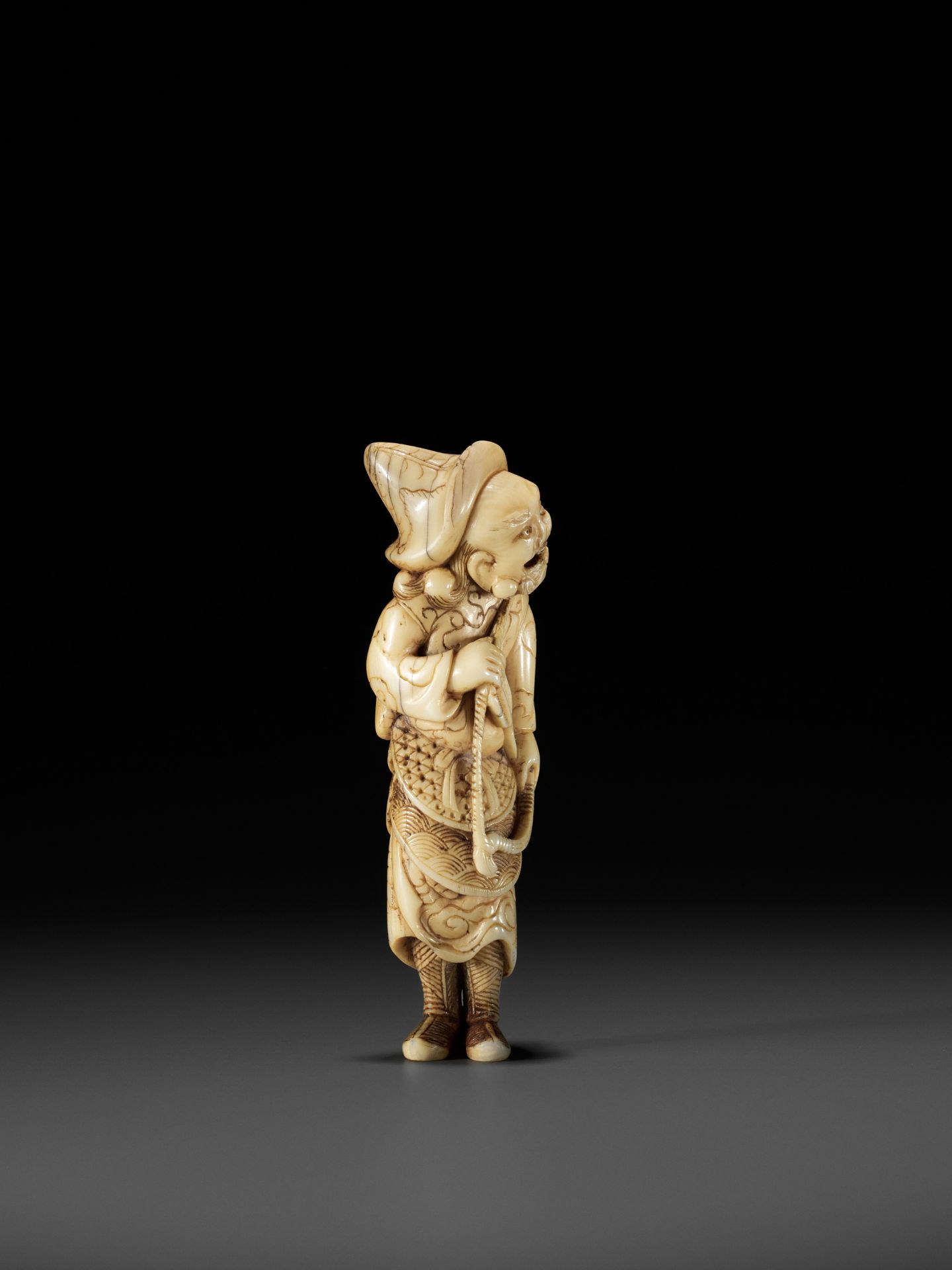 A POWERFUL TALL IVORY NETSUKE OF A TARTAR ARCHER - Image 9 of 11