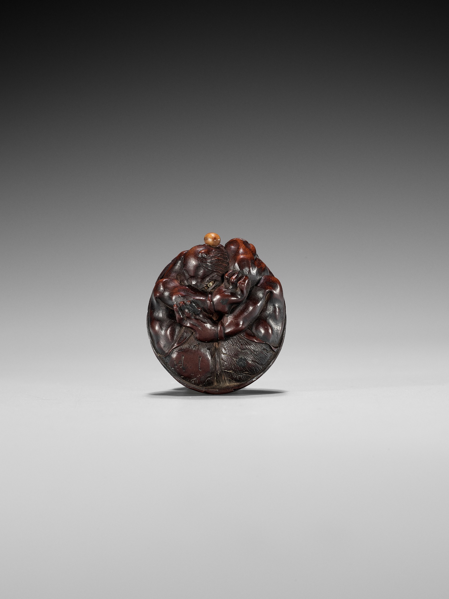 MASAKAZU: A WOOD NETSUKE OF A COWERING ONI DURING SETSUBUN - Image 11 of 13