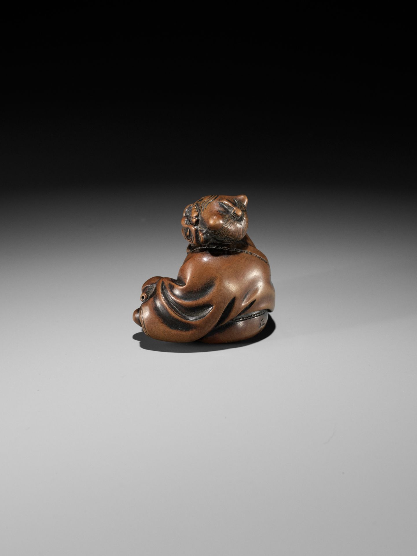 MASAYUKI: A FINE WOOD NETSUKE OF A SMOKING ONI - Image 6 of 11