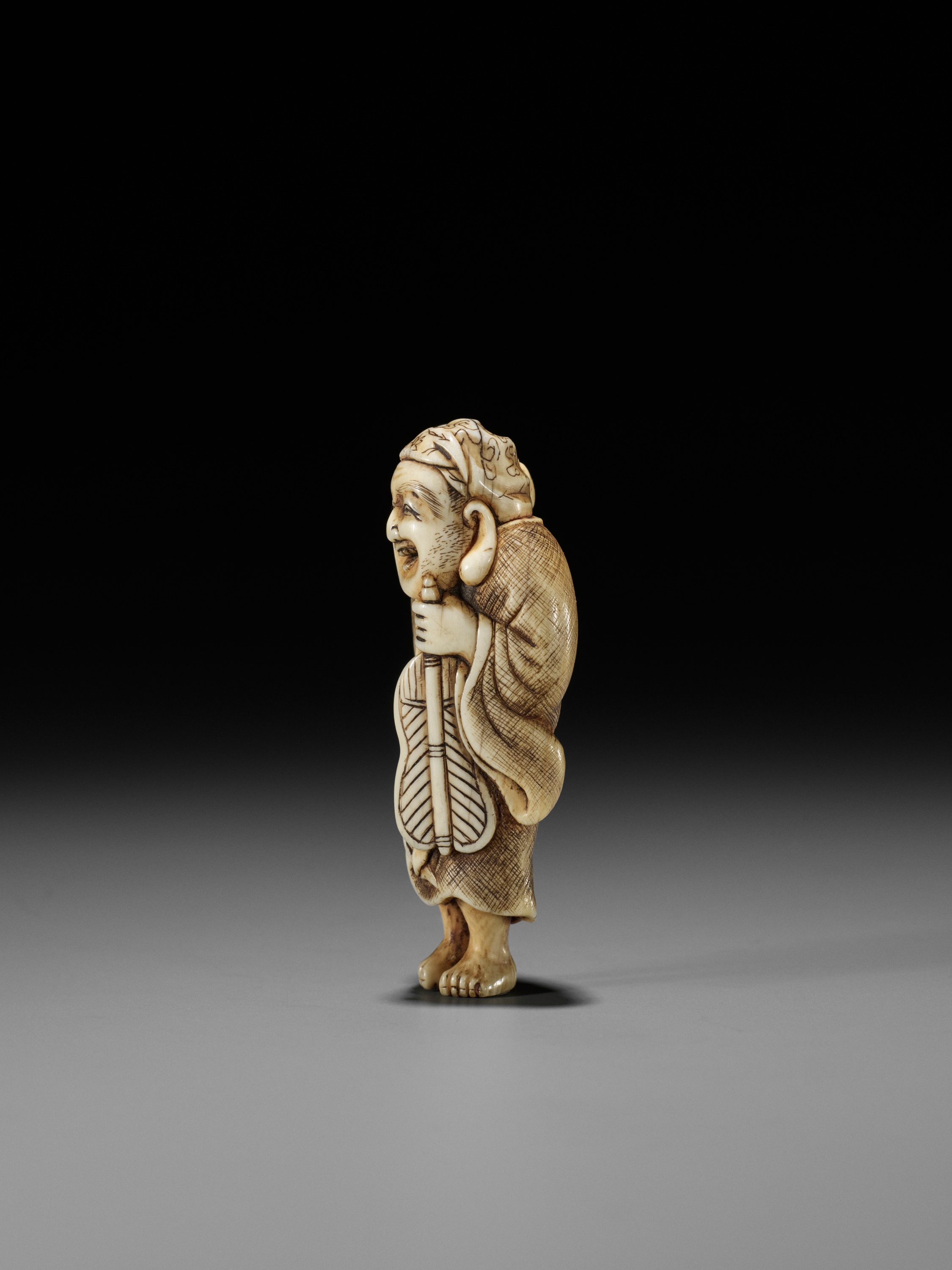 OKAKOTO: AN IVORY NETSUKE OF HOTEI WITH KARAKO - Image 6 of 12