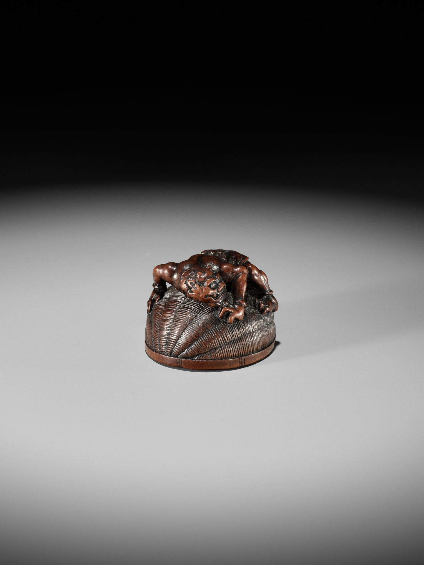 MASANAO: A RARE WOOD NETSUKE OF AN ONI TRAPPING SHOKI - Image 12 of 14