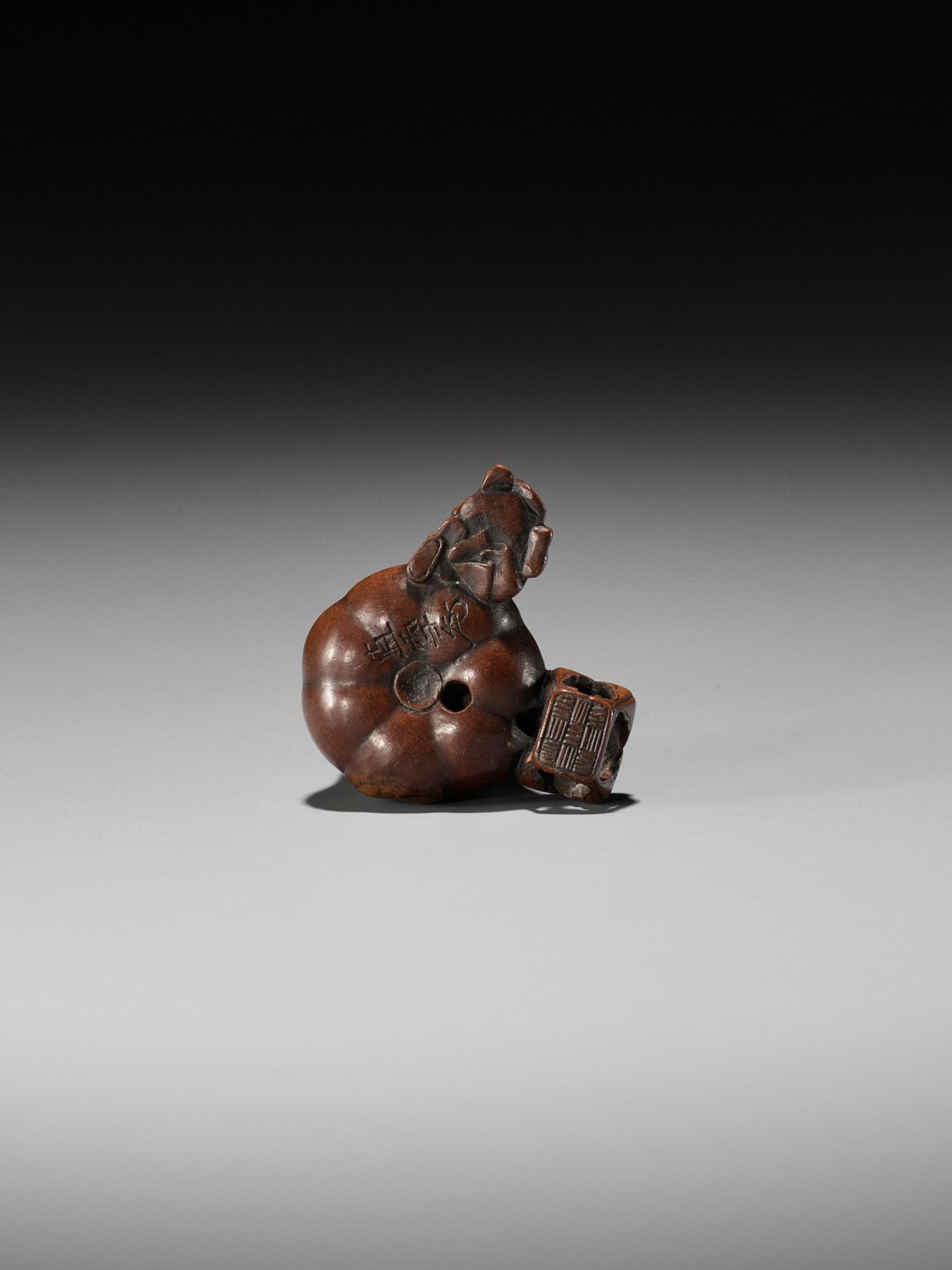 NAOYUKI: AN EXQUISITE MINIATURE WOOD NETSUKE OF A NIO CUTTING THROUGH A GIGANTIC GOURD - Image 8 of 9